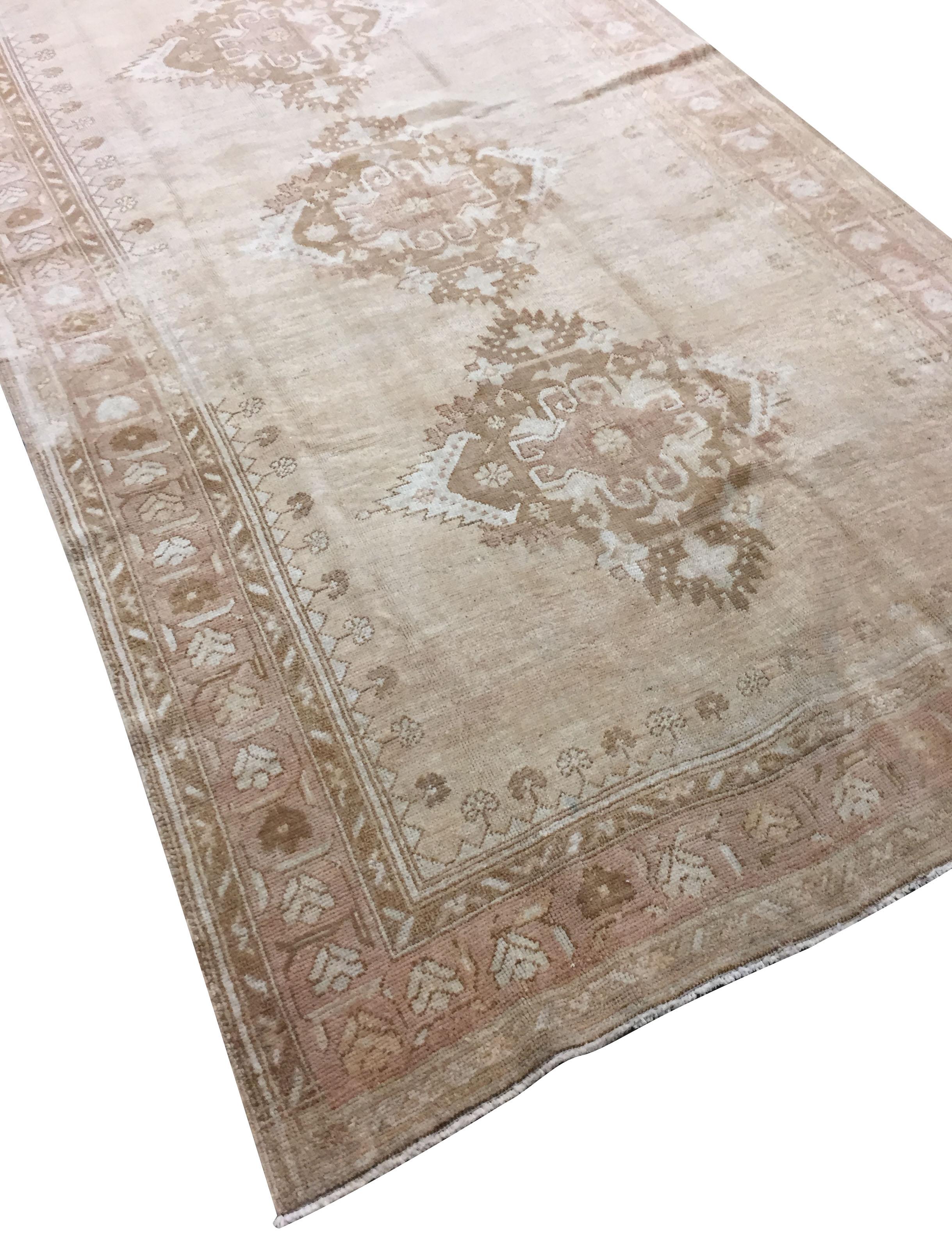 Vintage Turkish Oushak rug Runner 4'10 x 11'8. Hand-woven in Turkey where rug weaving is the culture rather than a business. Rugs from Turkey are known for the high quality of their wool their beautiful patterns and warm colors. These designer