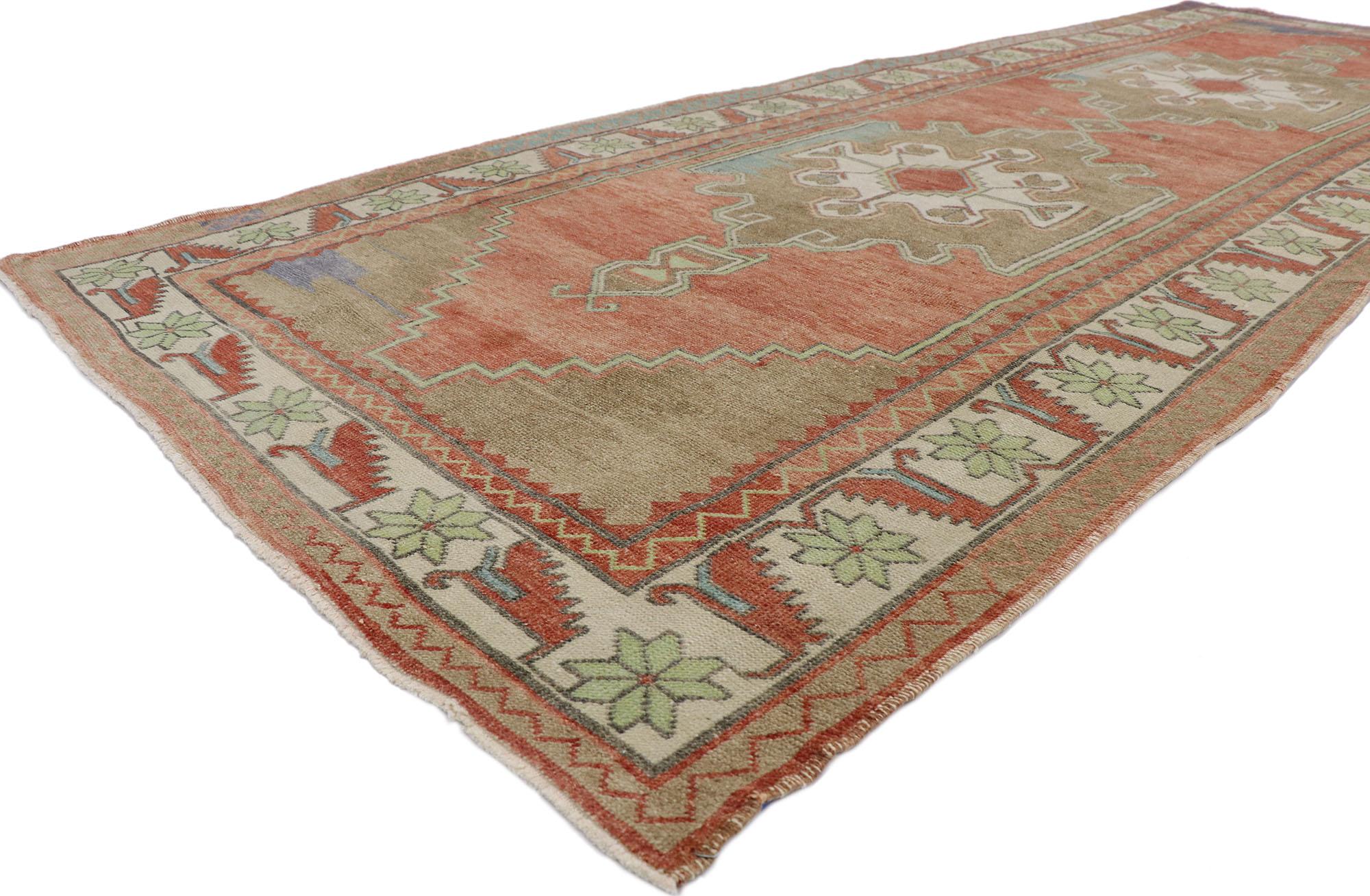 53628 Vintage Turkish Oushak Rug, 04'07 x 12'07.
Rustic sensibility meets nomadic charm in this hand knotted wool vintage Turkish Oushak rug. The intrinsic tribal design and earthy color palette woven into this piece work together creating a modern