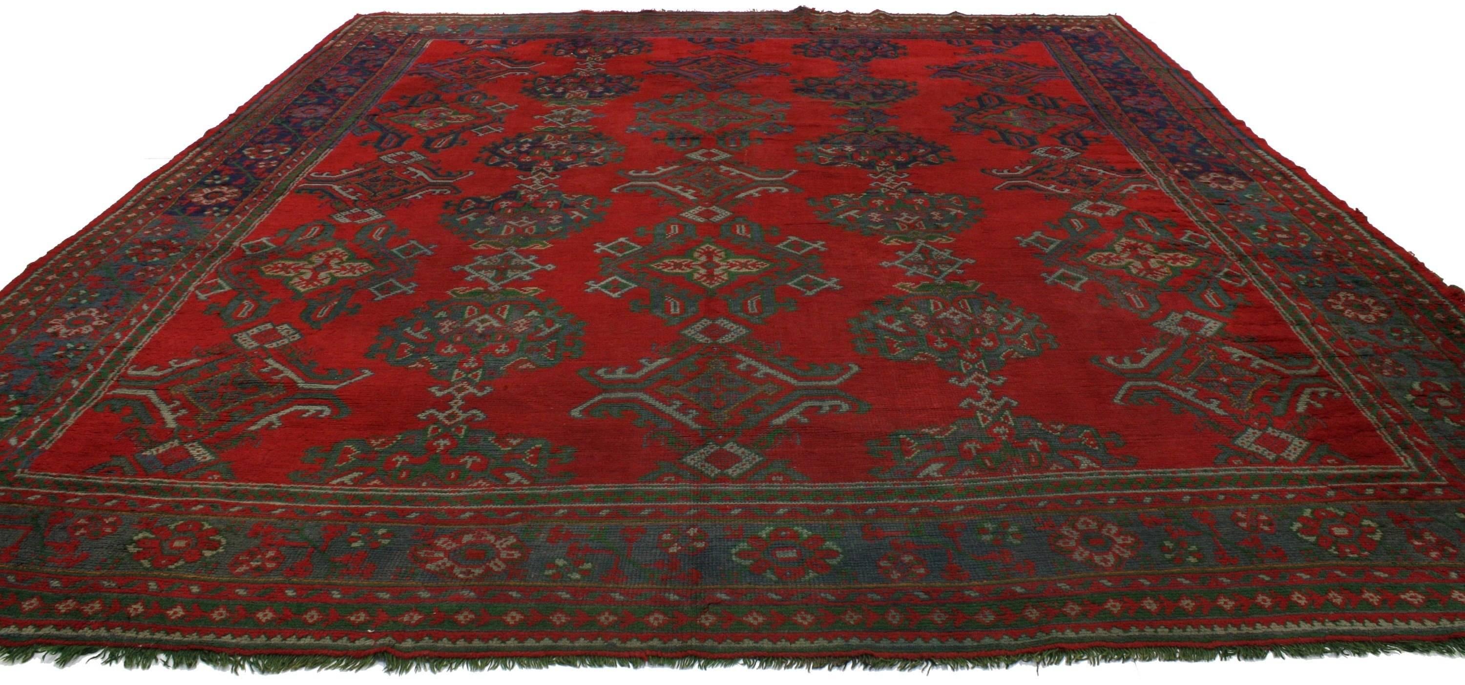 76606 Antique Turkish Oushak Thomas Eakins Inspired Rug, 11'07 X 13'07. This hand-knotted wool Antique Turkish Oushak rug not only carries deep meaning woven within the piece, but it is also very similar to the Oushak rug is in a painting from 1876,