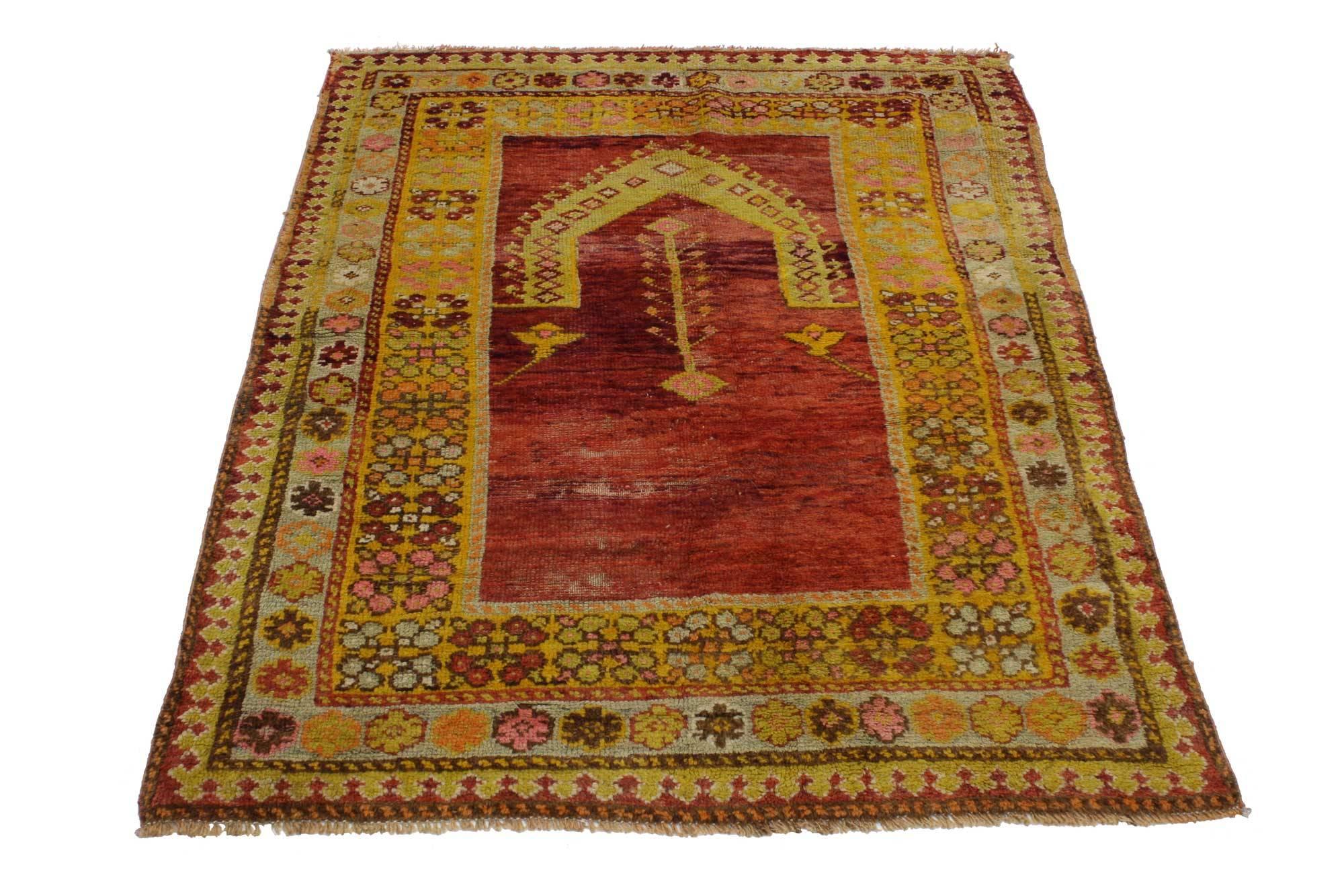 51748 Vintage Turkish Oushak rug, Turkish prayer rug. This hand knotted wool vintage Turkish Oushak prayer rug features a Mihrab design set against an abrashed scarlet red field. The first prayer rugs were made circa the mid-15th century in the
