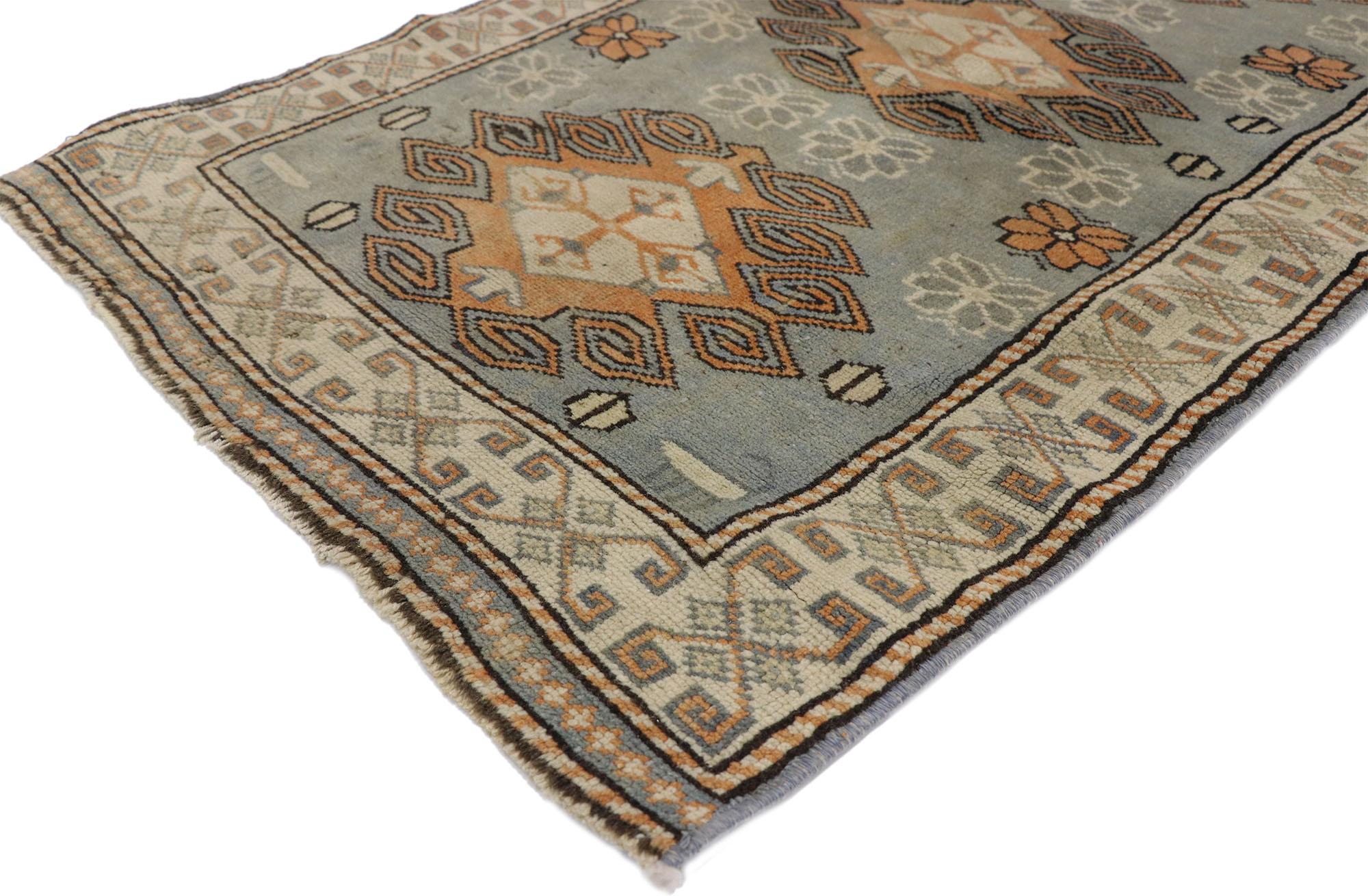 52586, vintage Turkish Oushak rug with Artisan Belgian style and soft colors. This hand knotted wool vintage Turkish Oushak rug features three oversized hooked diamond-shaped medallions spread across an abrashed gray field. The medallions are