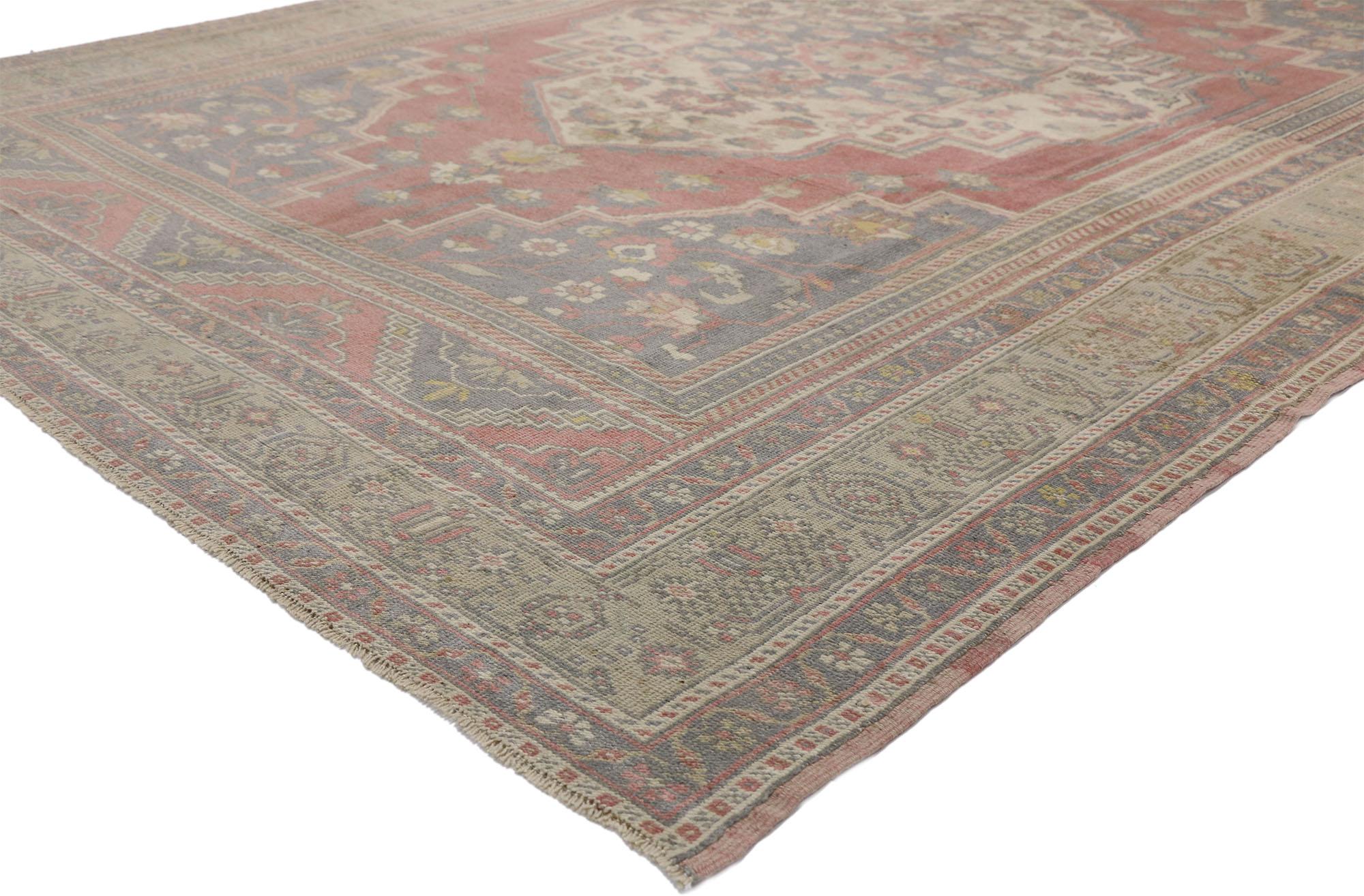 52436 Vintage Turkish Oushak Rug with Artisan and American Colonial Style. This hand knotted wool vintage Turkish Oushak rug showcases a traditional floral medallion on a faded field framed by pale lavender spandrels and ziggurat end-pieces. The