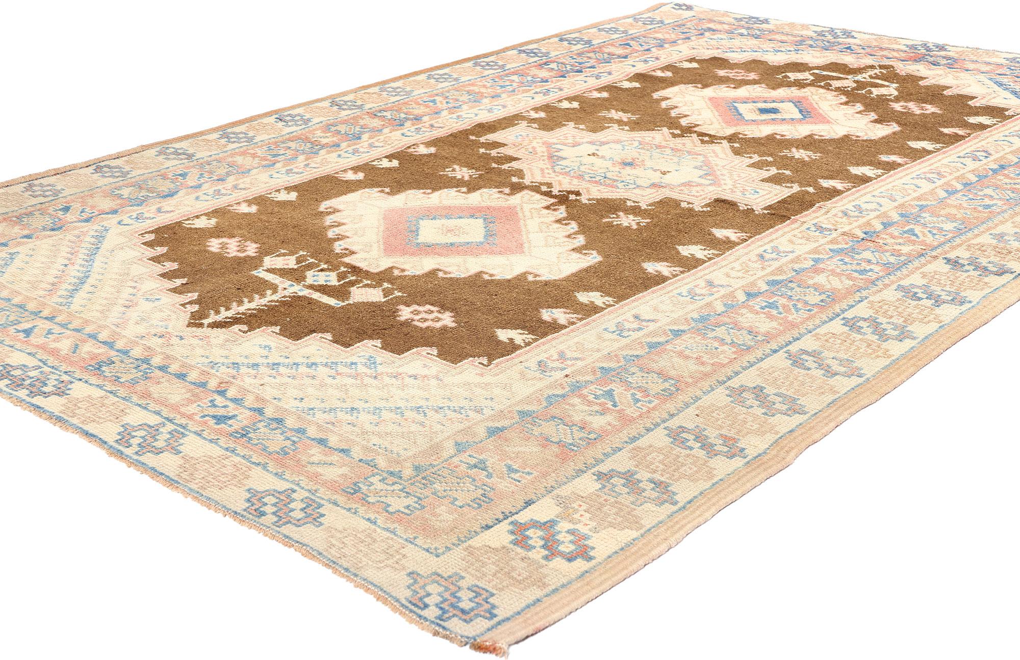 53617 Vintage Turkish Oushak Rug, 05'01 x 07'07. Replete with intricate details and boasting a bold tribal design softened by gentle hues, this hand-knotted wool vintage Turkish Oushak rug is a mesmerizing testament to the artistry of weaving. The