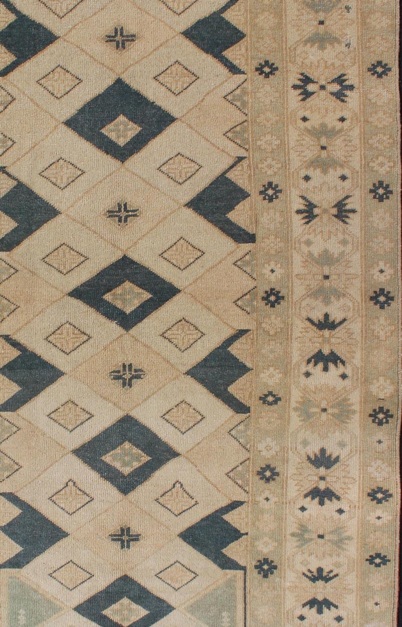 Measures: 4'2 x 7'1 
Vintage Turkish Oushak Rug with Bold Geometric Diamond Motifs 4'2 x 7'1. 
Keivan Woven Arts / Rug /TU-MTU-4854, country of origin / type: Turkey / Oushak, circa 1940.

This vintage Turkish Oushak rug showcases a rhythmic