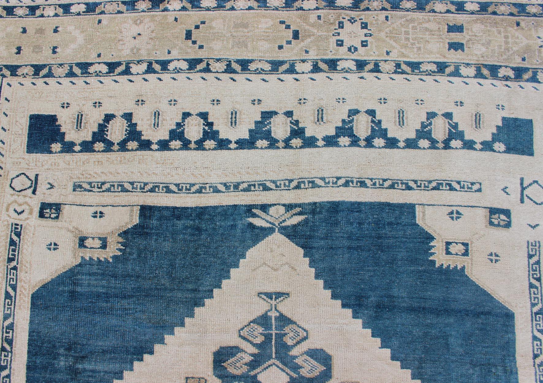 Wool Vintage Turkish Oushak Rug with Central Medallion in Blue and Cream For Sale