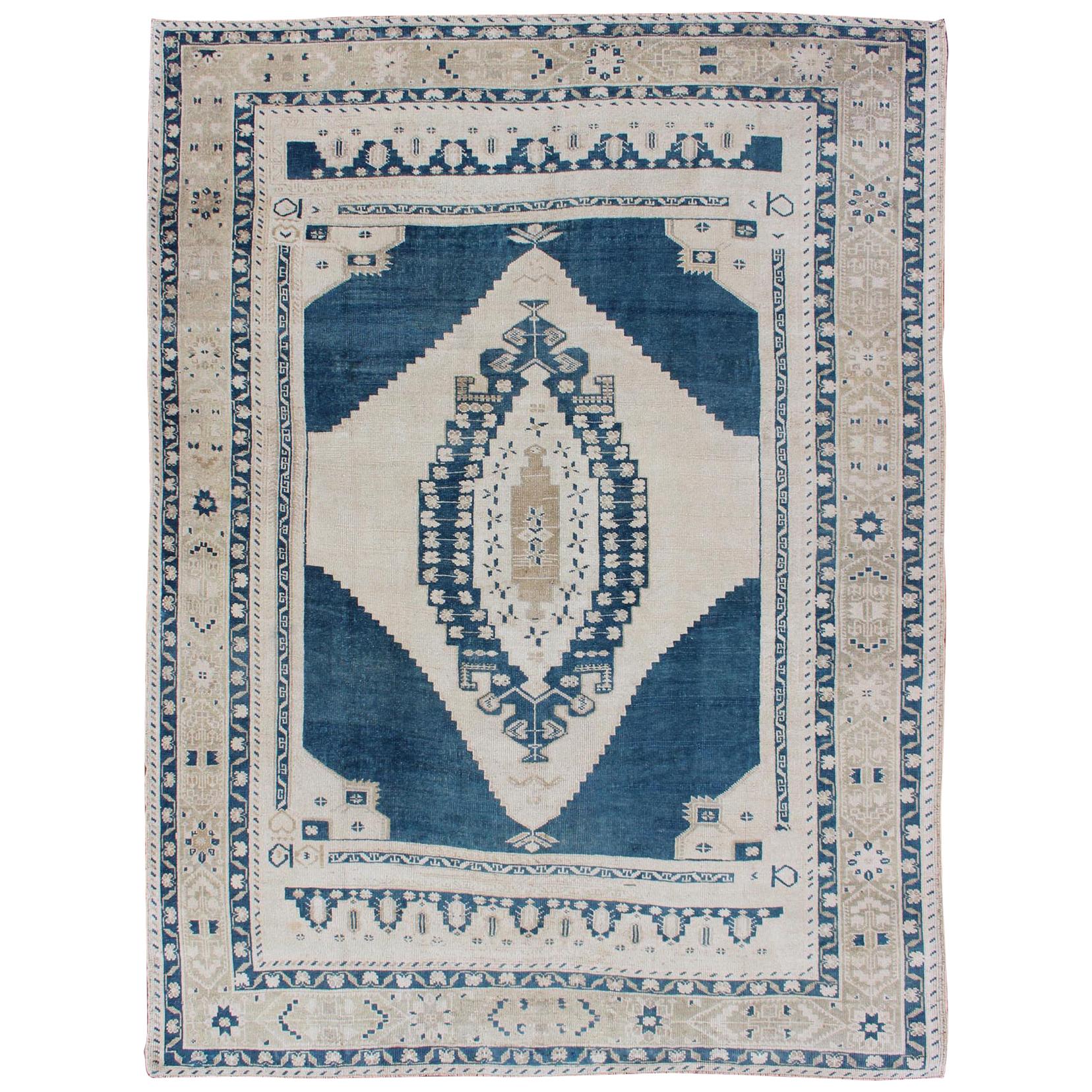 Vintage Turkish Oushak Rug with Central Medallion in Blue and Cream For Sale