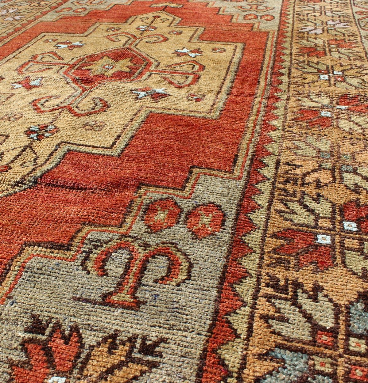 Mid-20th Century Vintage Turkish Oushak Rug with Colorful Layered Medallion For Sale