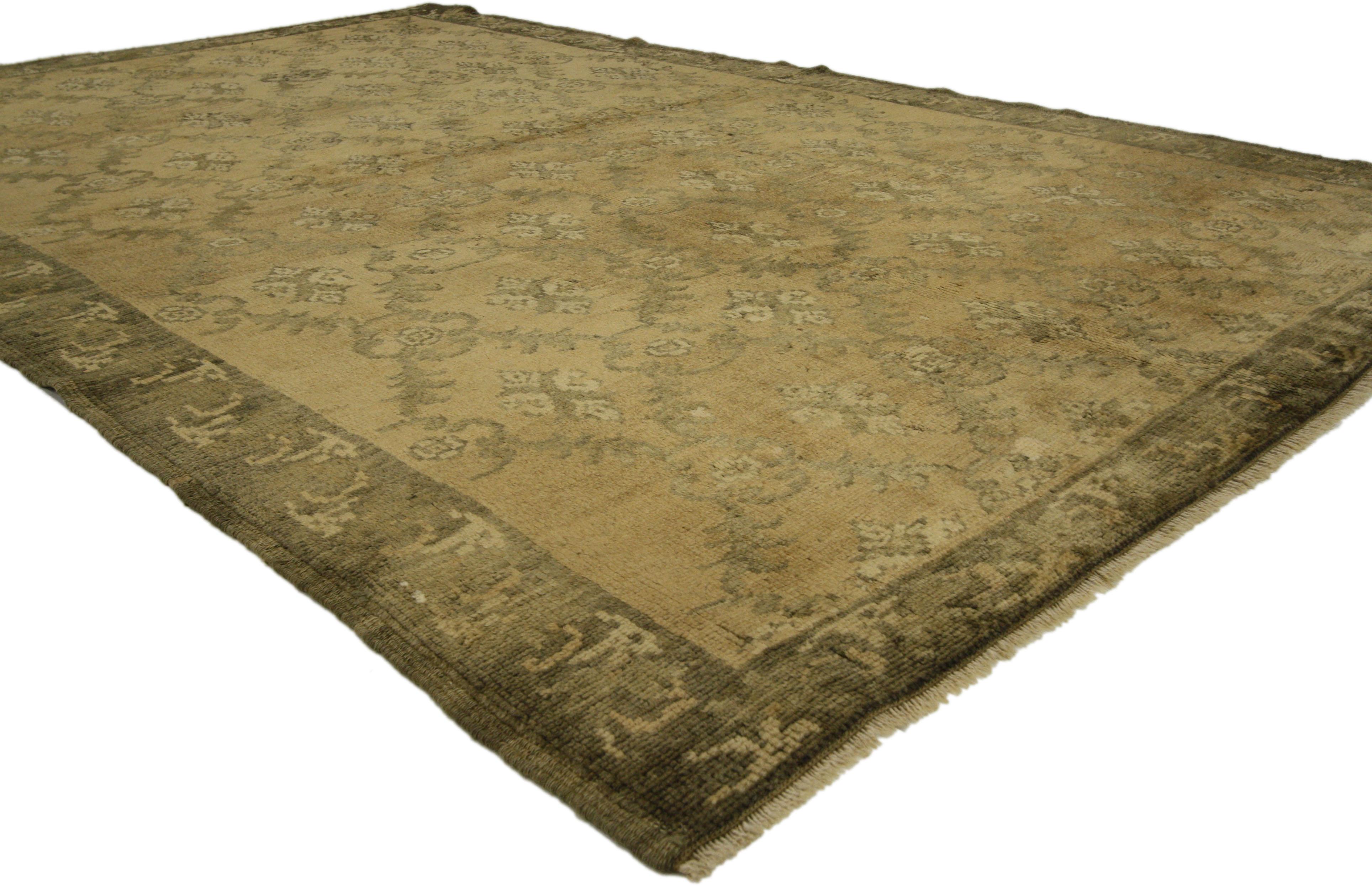 73634, vintage Turkish Oushak rug with Empire Regency style and golden colors. This hand knotted wool vintage Turkish Oushak rug features a dynamic all-over Mina Khani pattern spread across an abrashed camel field. Derived from 16th century Persian