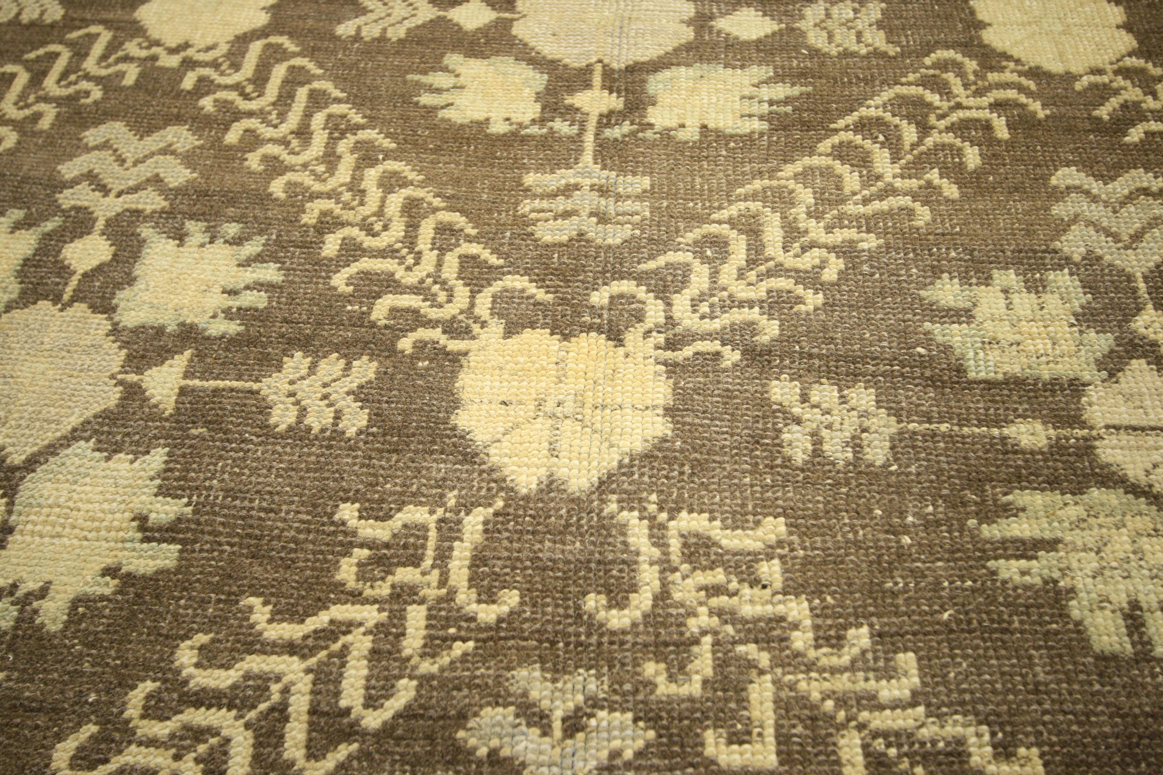 51028 vintage Turkish Oushak rug with English cottage style. This hand knotted wool vintage Turkish Oushak rug features an all-over floral lattice pattern overlaid upon an abrashed ecru field. Rosettes connected by curvy vinery form the trellis,