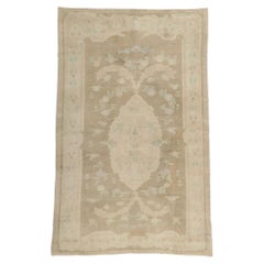 Used Turkish Oushak Rug with Faded Soft Earth-Tone Colors