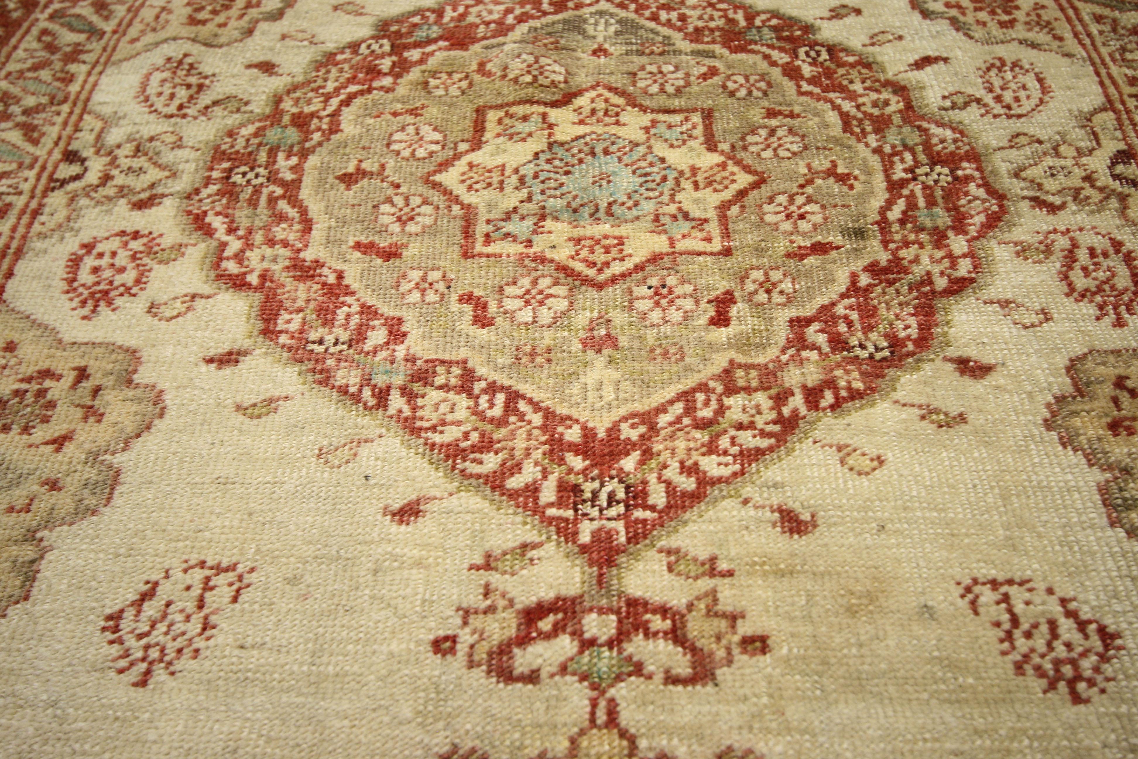 52325, vintage Turkish Oushak rug with French Rococo style. French Rococo refinement marry Turkish weaving excellence in this beautiful hand knotted wool vintage Oushak rug. A lobed and pointed medallion sets the stage for a plethora of boteh and