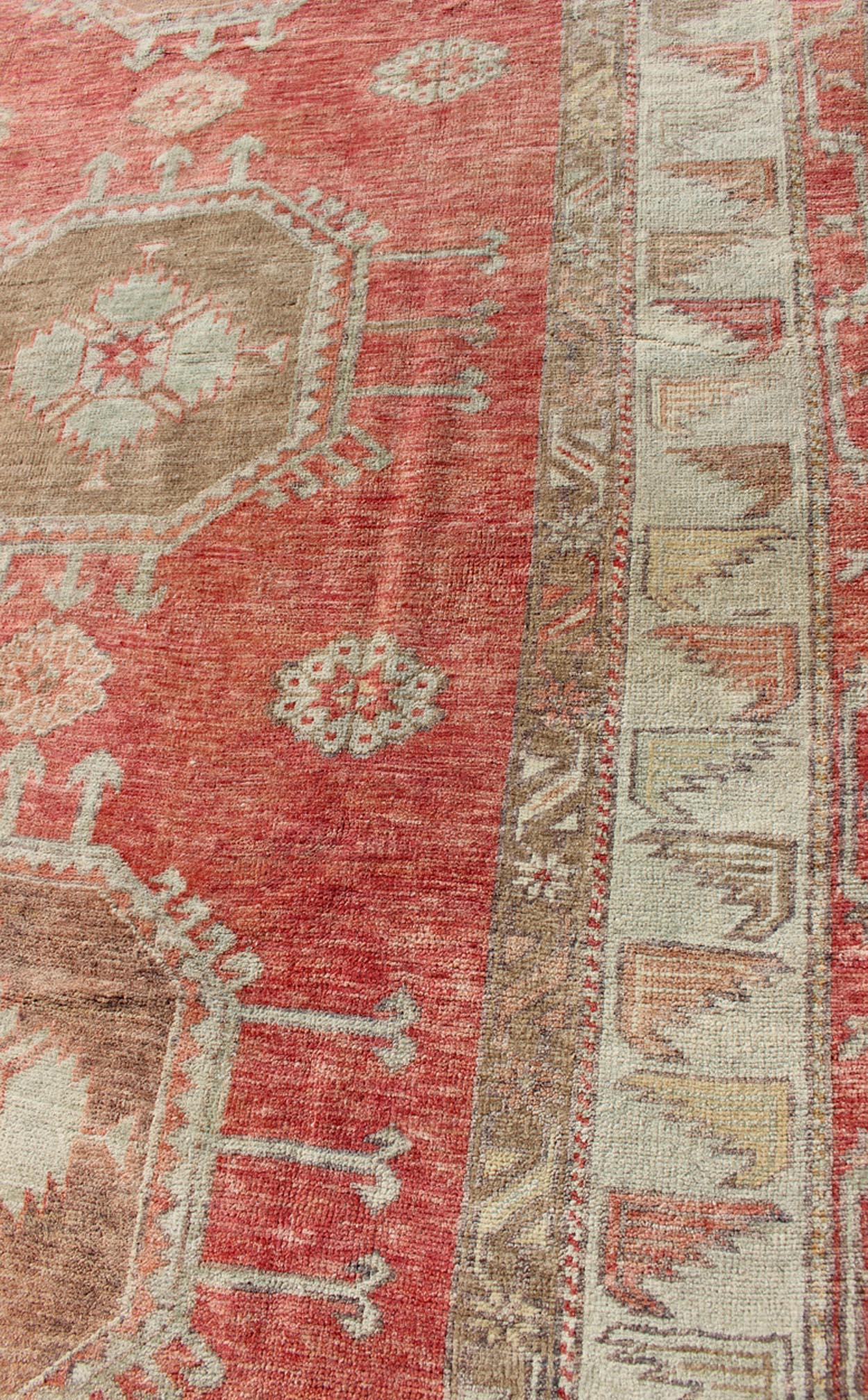 Mid-20th Century Vintage Turkish Oushak Rug with Geometric Medallions For Sale