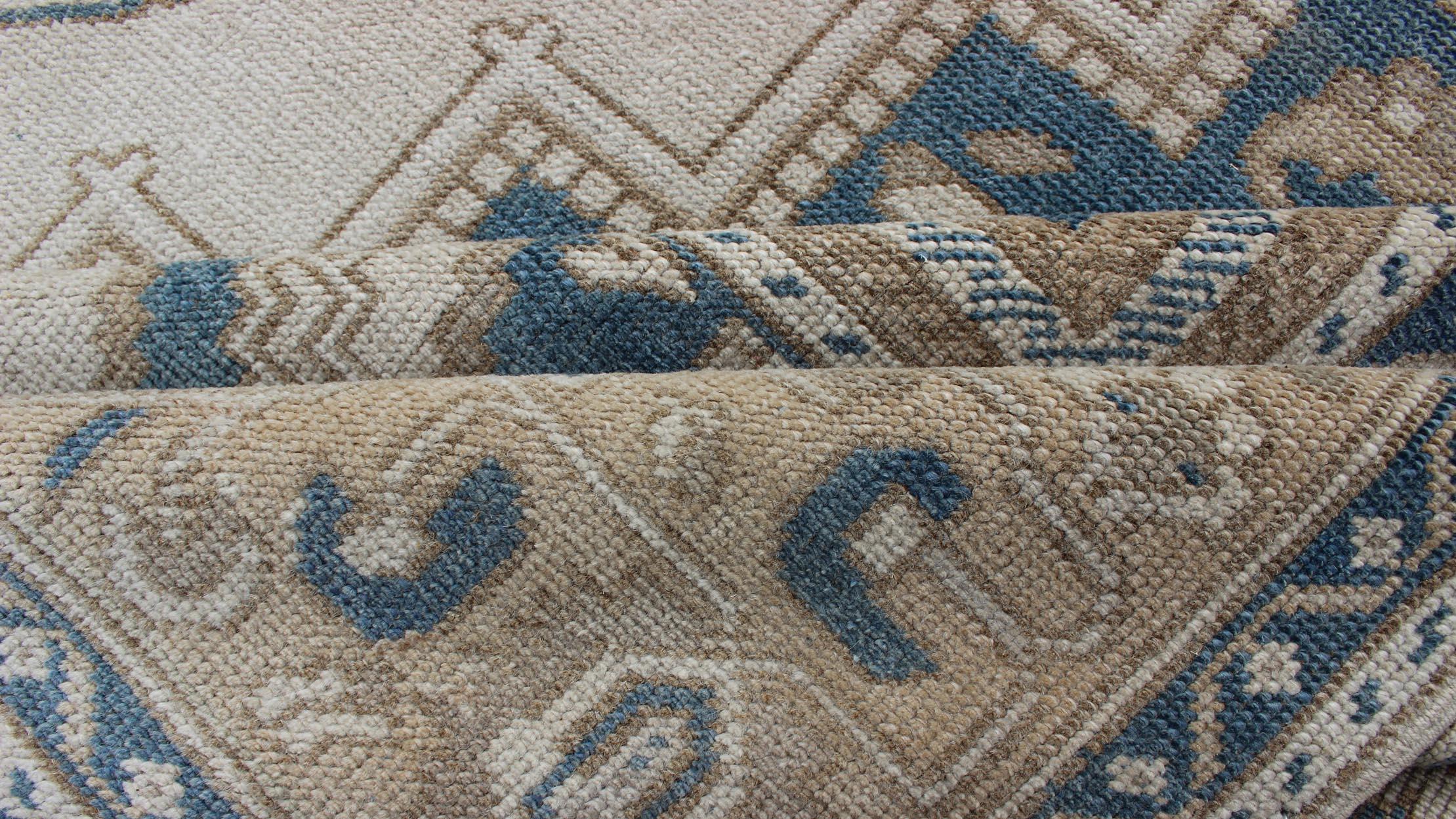 Mid-20th Century Vintage Turkish Oushak Rug with Geometric Design in Blue, Taupe and Sand For Sale