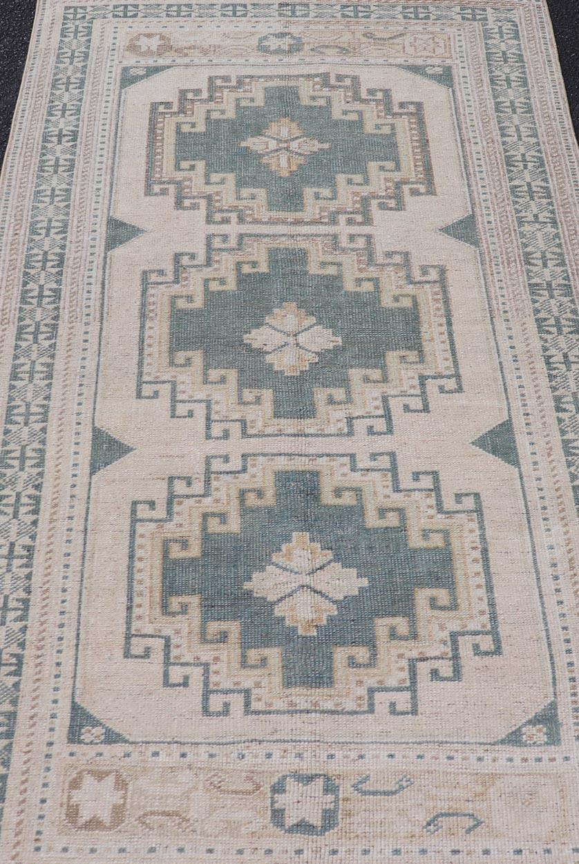 Measures: 3'3 x 6'1 

Vintage Turkish Oushak Rug With Geometric Medallions in Soft Green  3'3 x 6'1. Keivan Woven Arts / Rug / TU-MTU-31 Country of origin / type: Turkey / Oushak. 

Turkish Oushak rug is a beautiful example of traditional