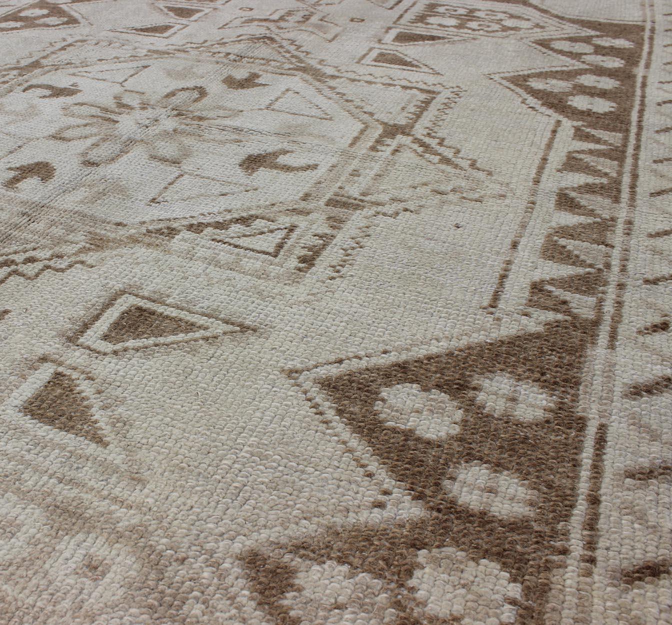 Measures:3'11 x 5'7 
Vintage Turkish Oushak Rug with Intricate Geometric Motifs 3'11 x 5'7. Keivan Woven Arts / Rug / TU-MTU-3442,  country of origin / type: Turkey / Oushak, circa 1940.
A beautiful example of traditional craftsmanship, this vintage