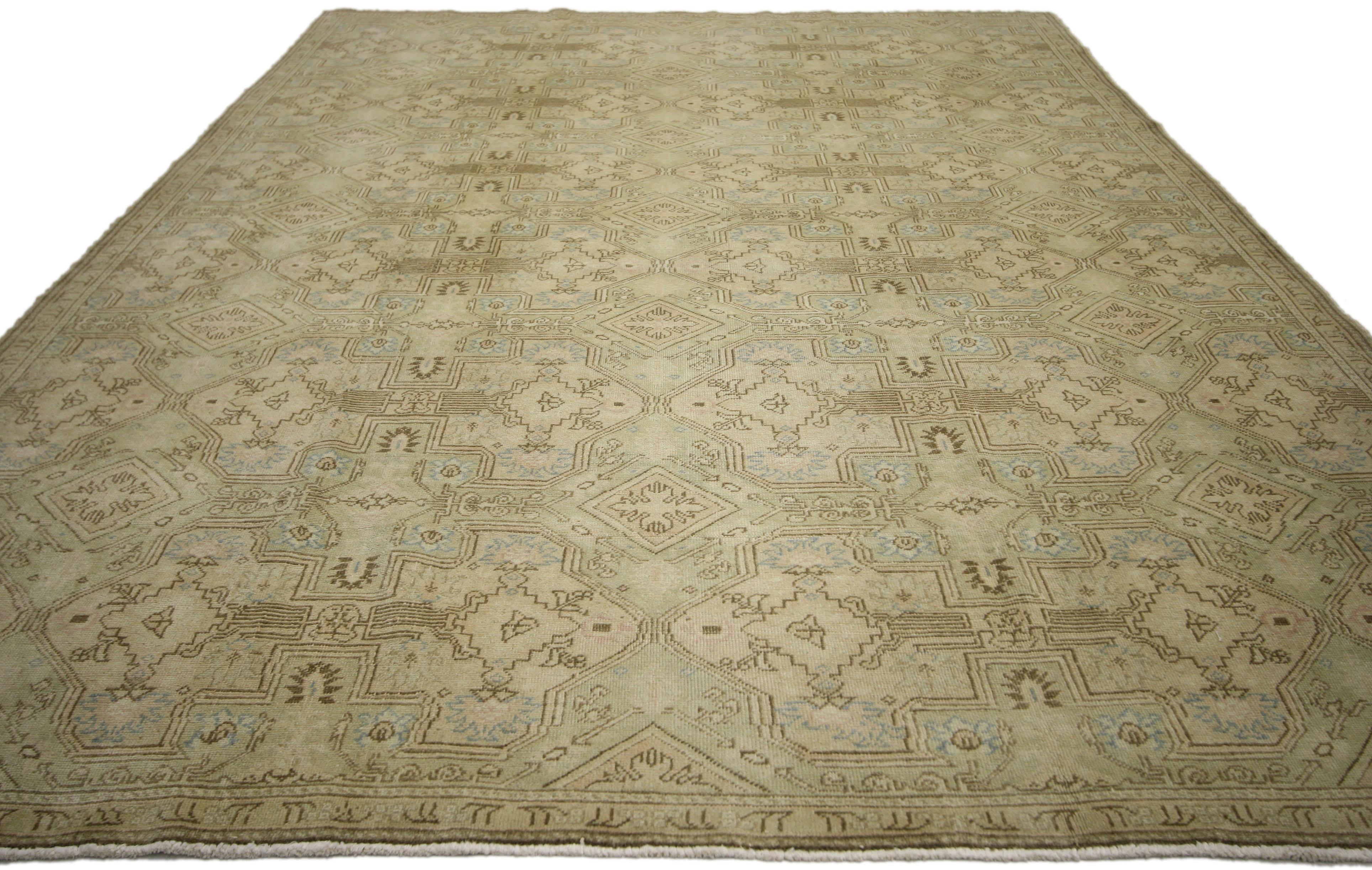 51038, vintage Turkish Oushak rug with Islamic geometric pattern and Elizabethan style. This hand knotted wool vintage Turkish Oushak rug beautifully showcases Elizabethan style highlighting its all-over symmetrical Islamic geometric pattern of