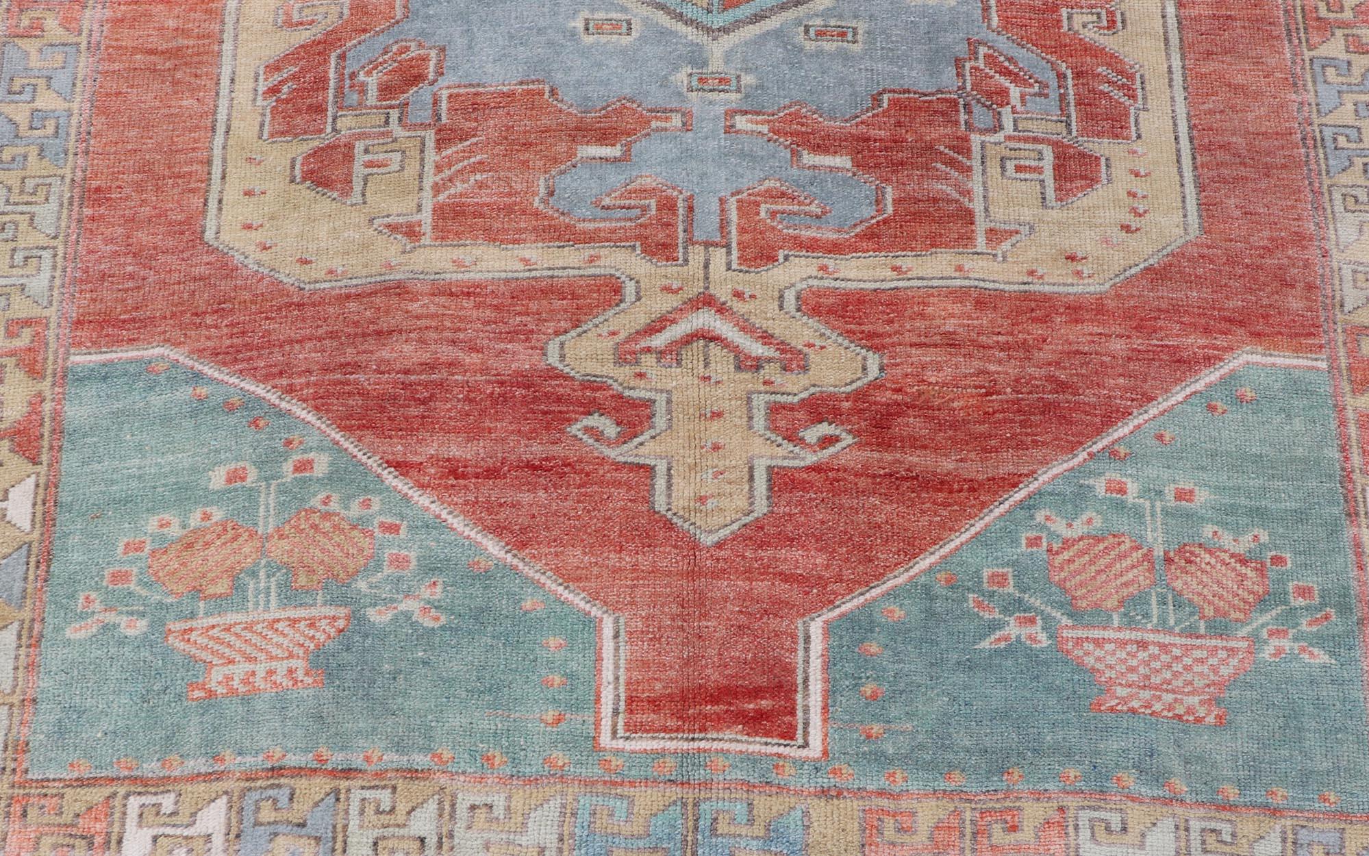 Wool Vintage Turkish Oushak Rug with Large Medallion Design in Soft Red, Blue, Yellow For Sale