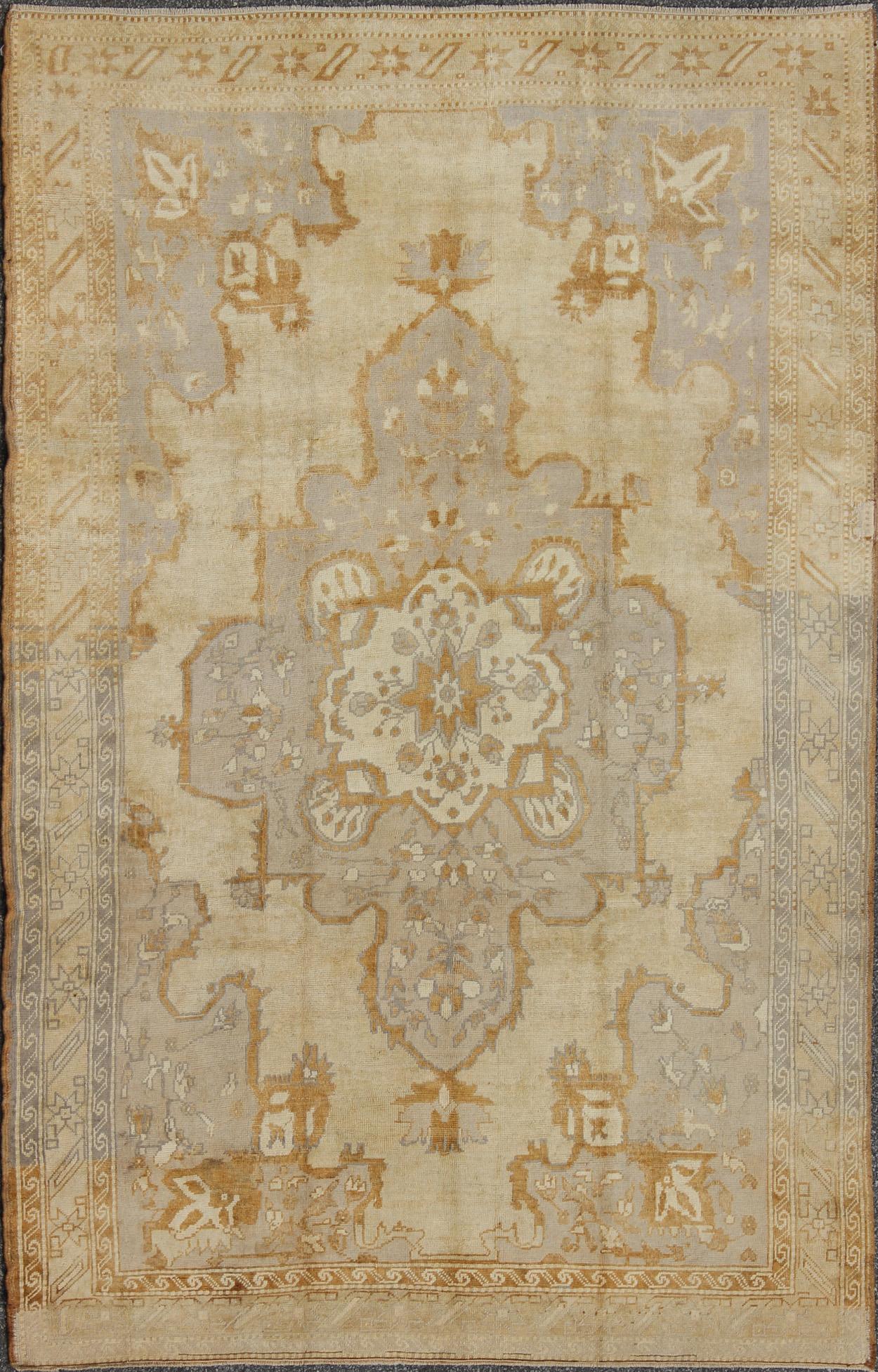 Mid-20th Century Vintage Turkish Oushak Rug with Medallion Design and Corniced Floral Border For Sale