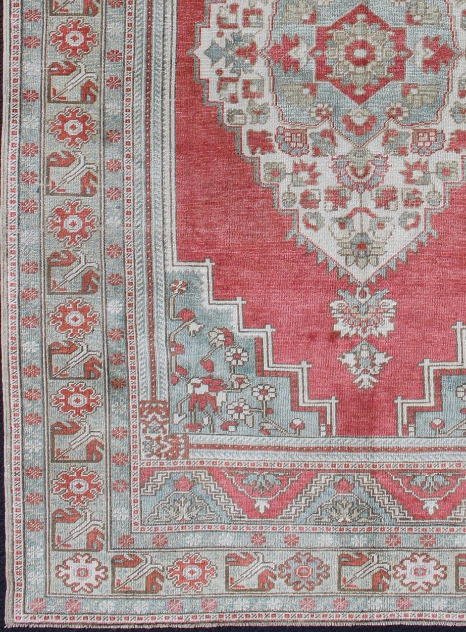 Hand-Knotted Vintage Turkish Oushak Rug with Medallion Design in Pink Red and Gray Blue For Sale