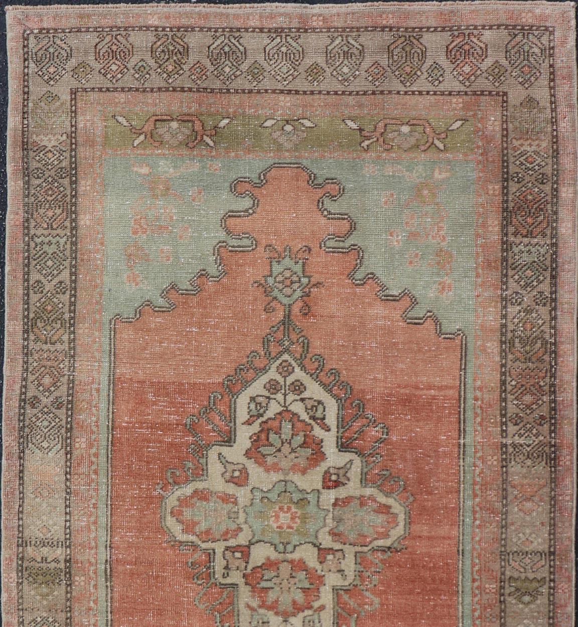 Vintage Turkish Oushak Rug With Medallion in Earthy Color Tones With Coral Color In Good Condition For Sale In Atlanta, GA