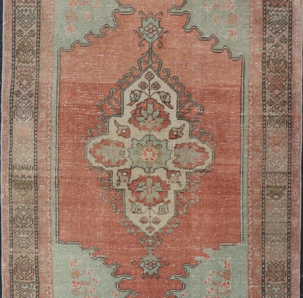 20th Century Vintage Turkish Oushak Rug With Medallion in Earthy Color Tones With Coral Color For Sale