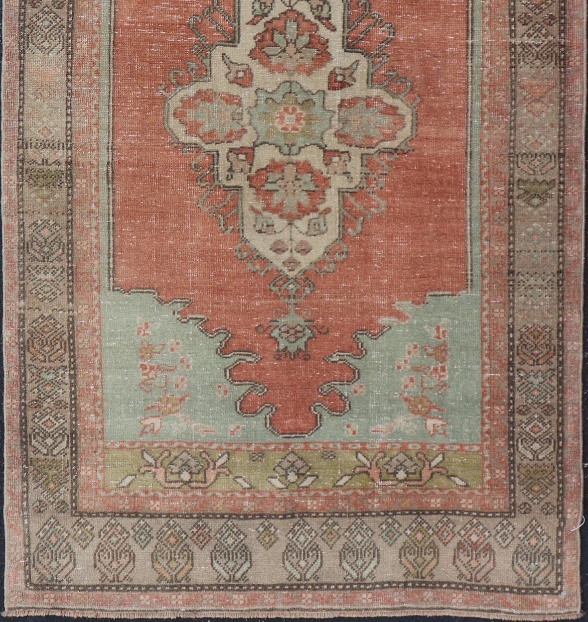 Wool Vintage Turkish Oushak Rug With Medallion in Earthy Color Tones With Coral Color For Sale