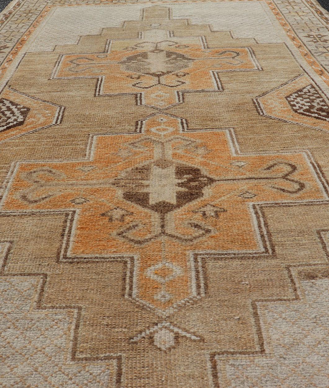 Hand-Knotted Vintage Turkish Oushak Rug With Medallions in Earthy Color Tones with Orange For Sale