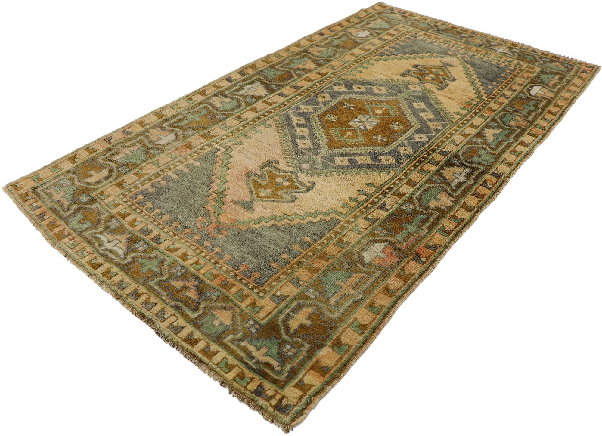 53184 vintage Turkish Oushak rug with Mid-Century Modern Belgian style. Balancing traditional sensibility with a timeless design in earth-tone colors, this hand knotted wool vintage Turkish Oushak rug charms with ease. The abrashed tan backdrop