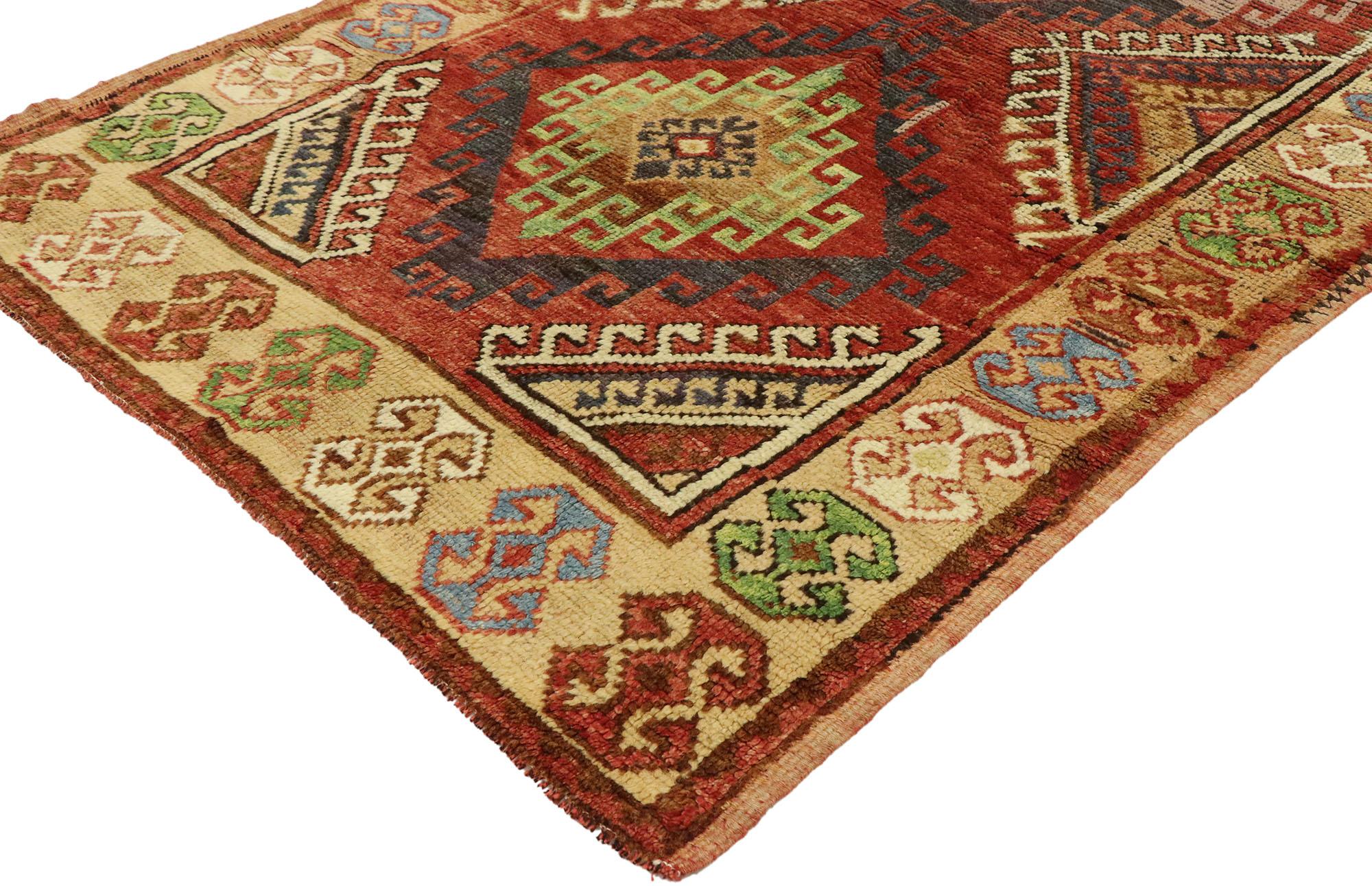 53056, vintage Turkish Oushak rug with Mid-Century Modern Tribal style. Blending tribal charm, ancient symbolism and Folk Art warmth, this hand knotted wool vintage Turkish Oushak rug beautifully showcases a bold elemental design. The abrashed field