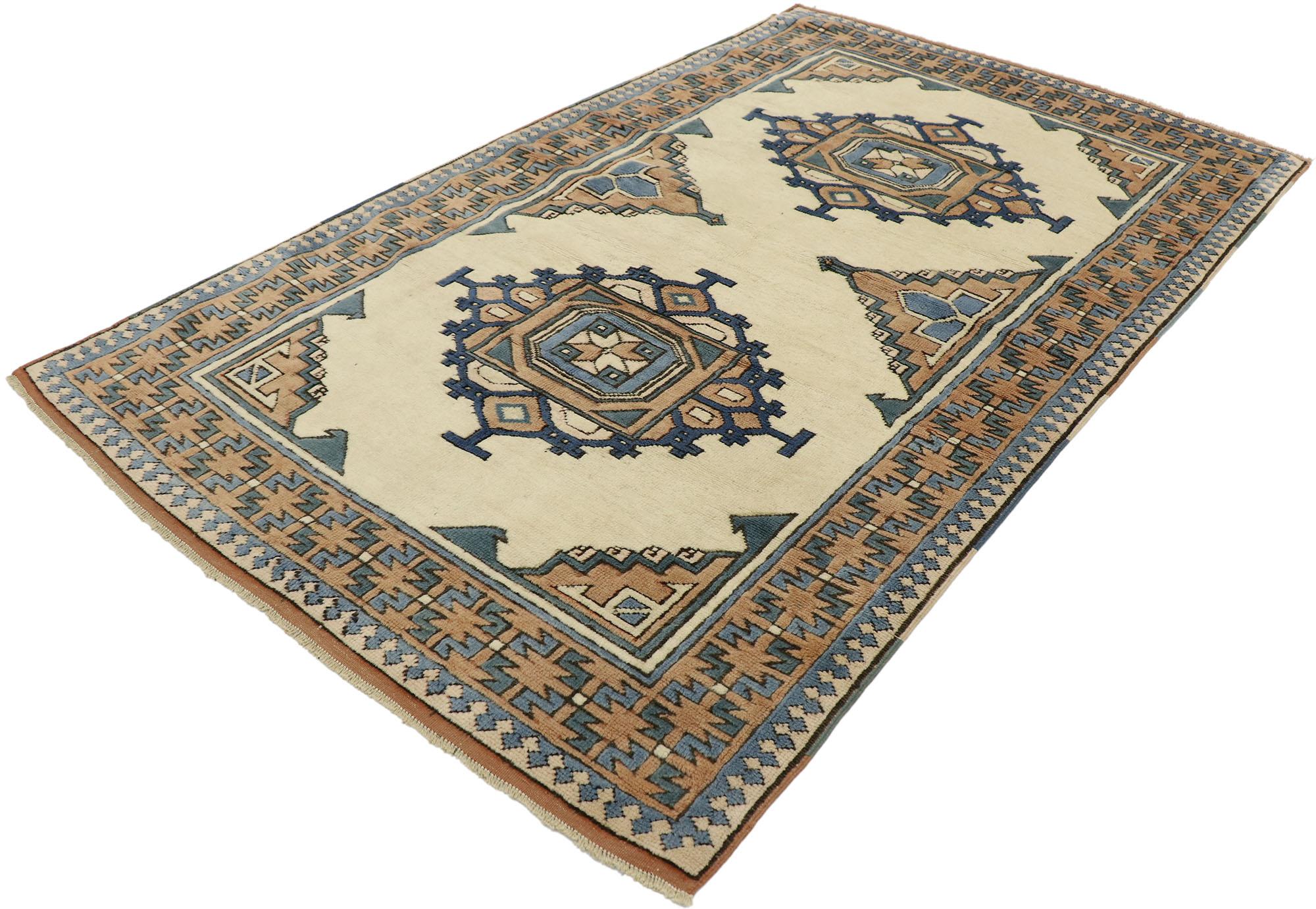 53186, vintage Turkish Oushak rug with Mid-Century Modern Tribal style. Imbued with Caucasian influence and earthy-inspired colors, this hand knotted wool vintage Turkish Oushak rug balances traditional sensibility and tribal style. The abrashed