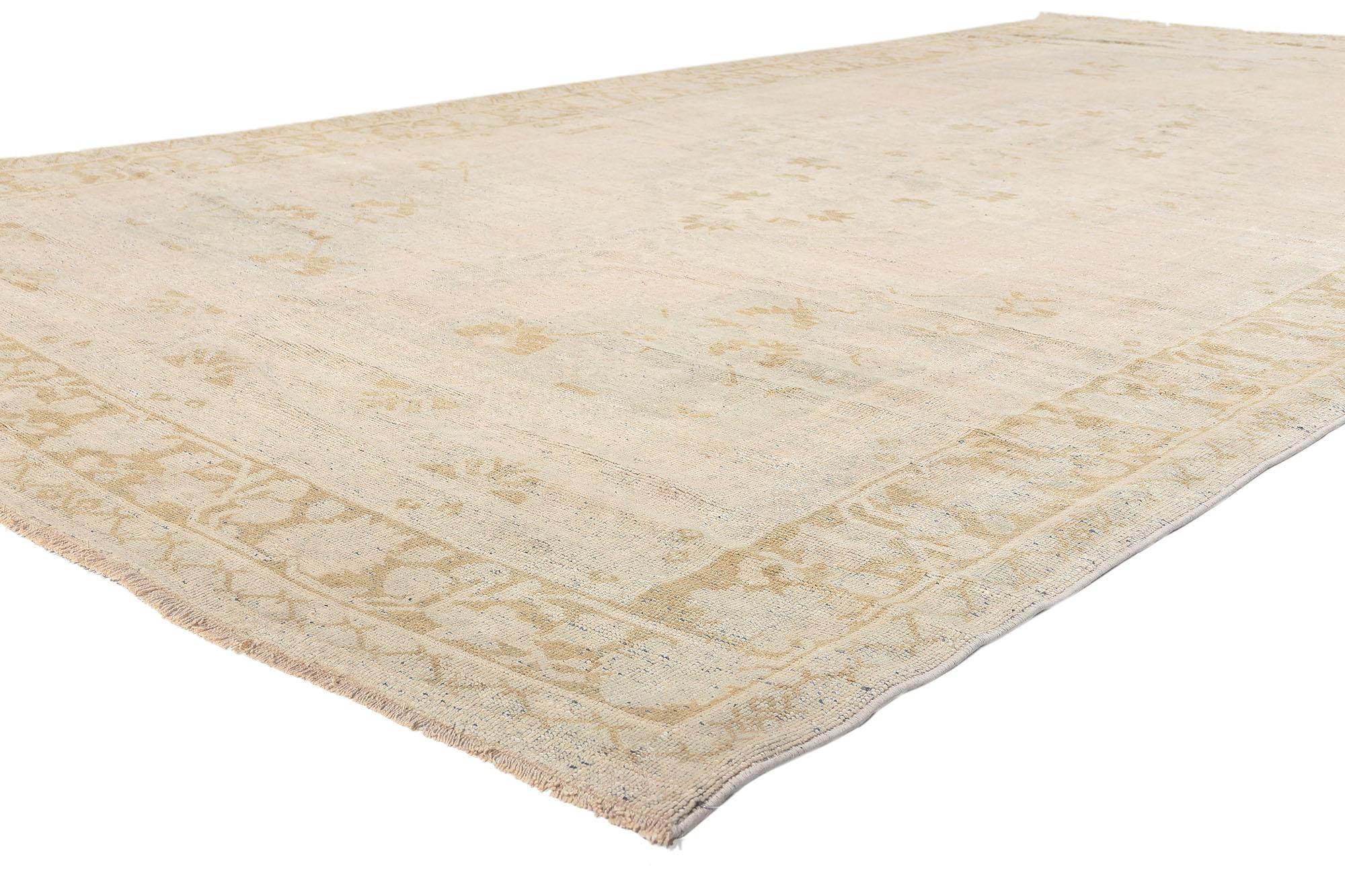 53677 Vintage Muted Oushak Turkish Rug, 07'00 x 13'02. 
​Quiet sophistication meets timeless Anatolian charm in this hand knotted wool vintage Turkish Oushak rug. The faded botanical silhouette and muted neutral colors woven into this piece work