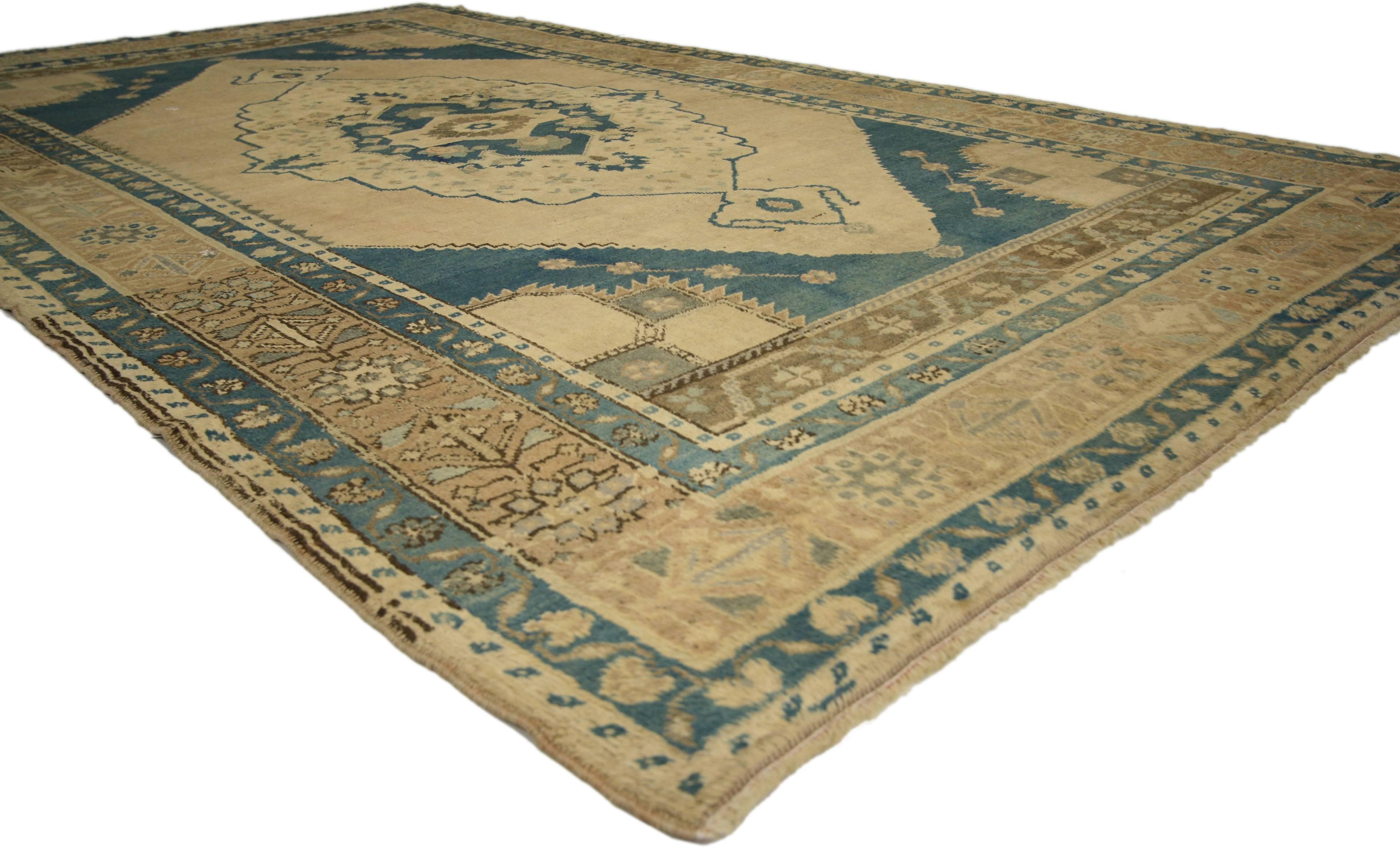 74103 Vintage Turkish Oushak Rug with Mid-Century Modern Style 05’06 x 09’10. Warm and inviting, this hand-knotted wool vintage Turkish Oushak rug beautifully embodies mid-century modern style. It features an elongated cusped center medallion