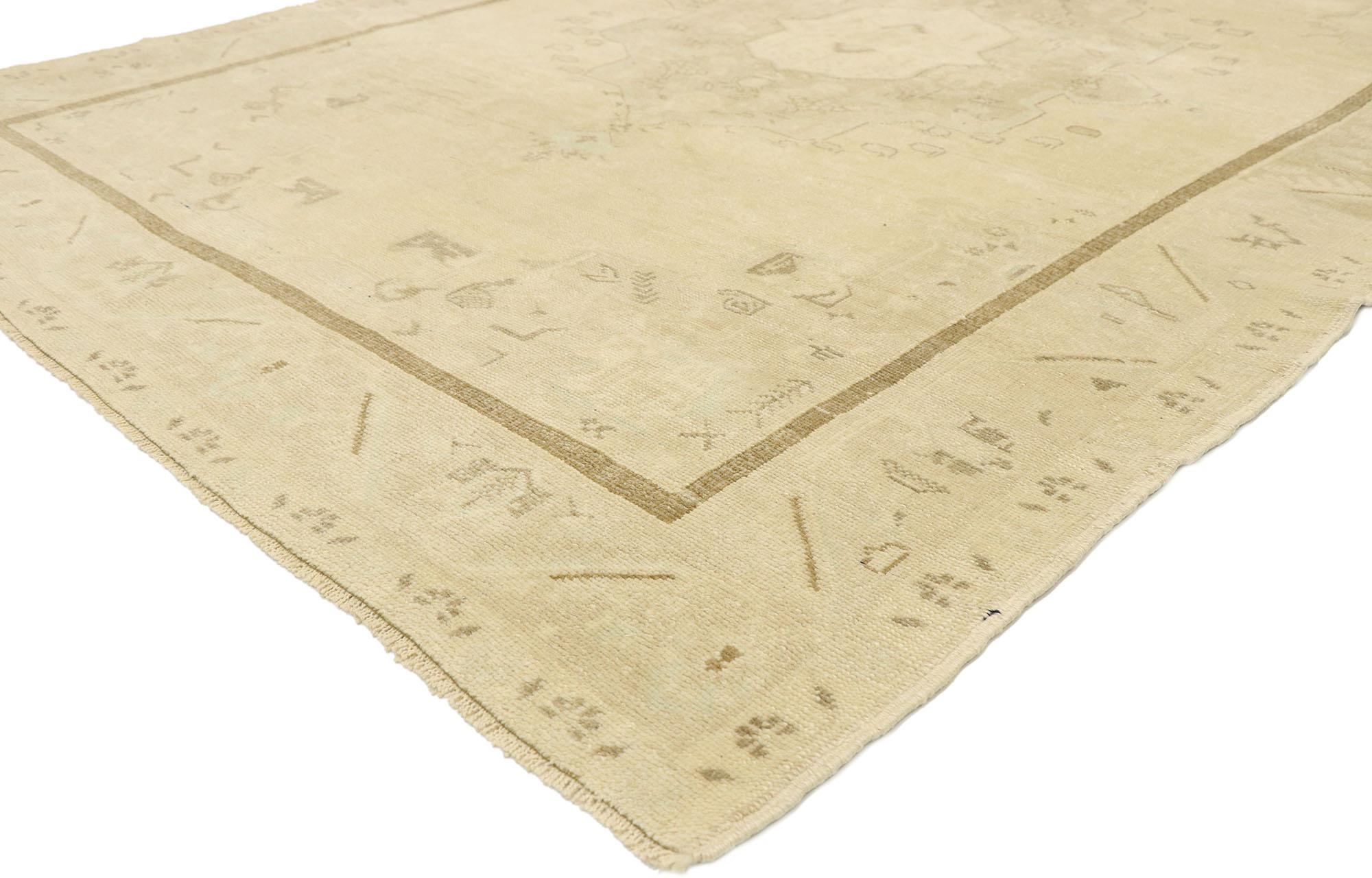 52960 vintage Turkish Oushak rug with Modern Monochromatic Mission style. Emanating sophistication and grace, this hand knotted wool vintage Turkish Oushak rug provides an elegant and genteel design aesthetic with soft subtle hues. A cusped central