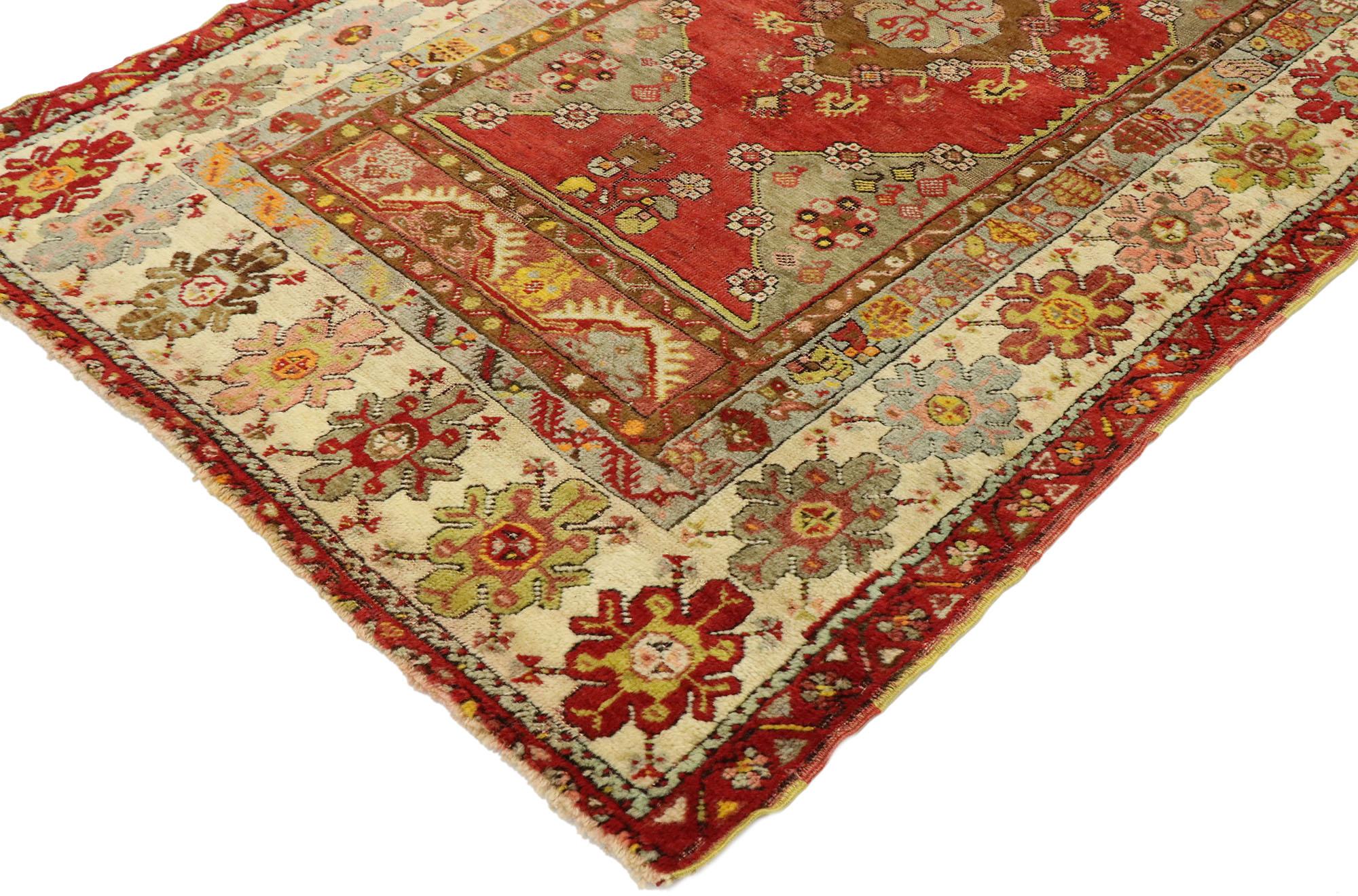 53058, vintage Turkish Oushak rug with Modern Rustic Tribal style. With vibrant colors and rustic sensibility, this hand knotted wool vintage Turkish Oushak rug is poised to impress. It features a traditional medallion design composed of a central