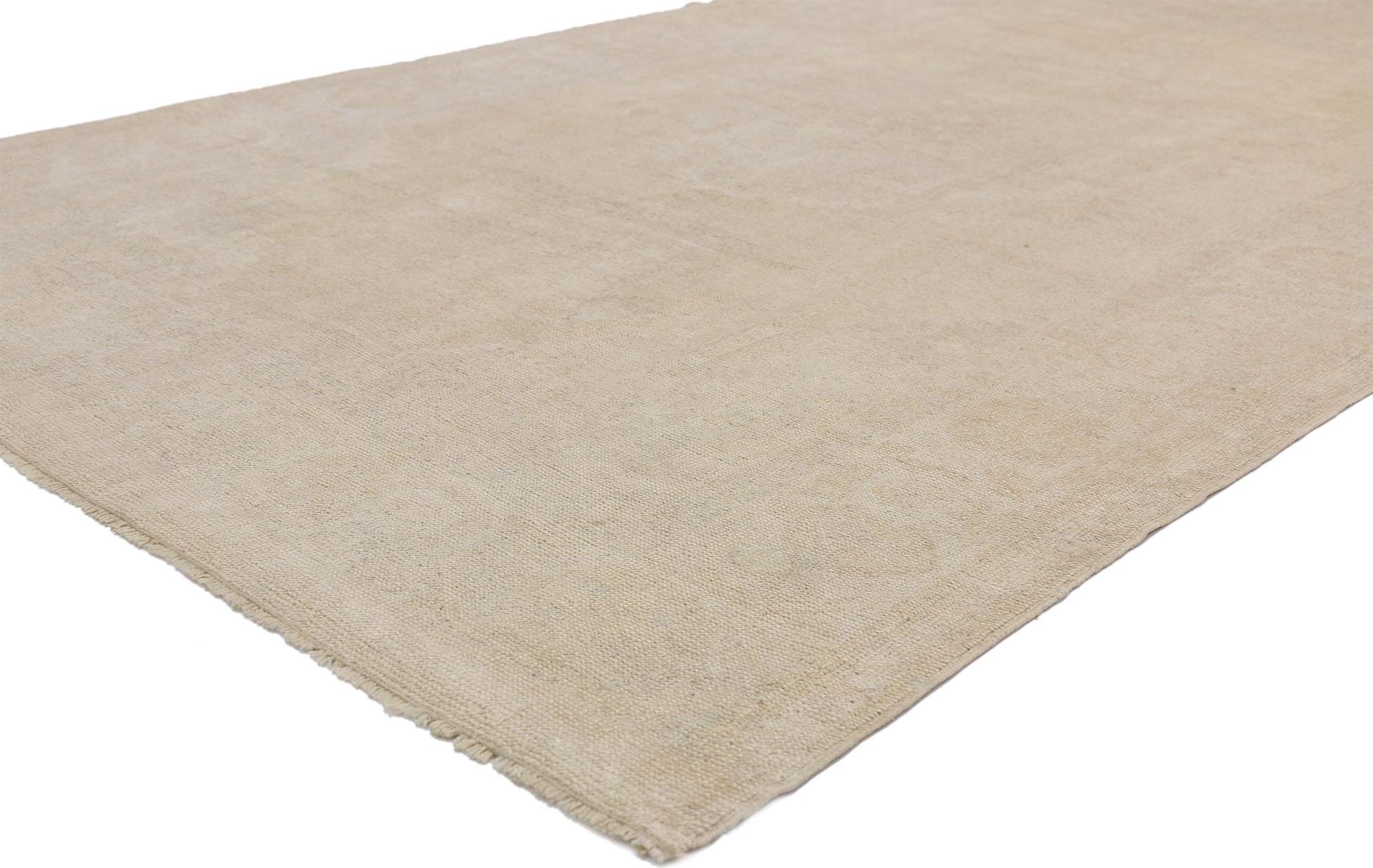 52501, vintage Turkish Oushak rug with monochromatic Mission style and subdued colors. This hand knotted wool vintage Turkish Oushak rug features a subtle central medallion in an open abrashed field. It is enclosed with subdued spandrels in each