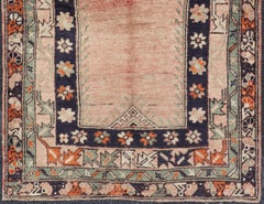 Vintage Turkish Oushak Rug Featuring a Soft Coral Field with Navy, Sage Green