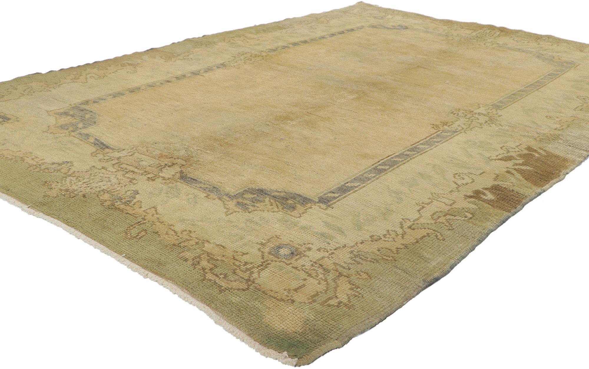 73786 Vintage Turkish Oushak Rug, 04'07 X 06'11. 
Delicately disarming and subtly displaying floral beauty, this hand knotted wool vintage Turkish Oushak rug beautifully embodies a French Chalet style with a hint of Gustavian grace. The abrashed