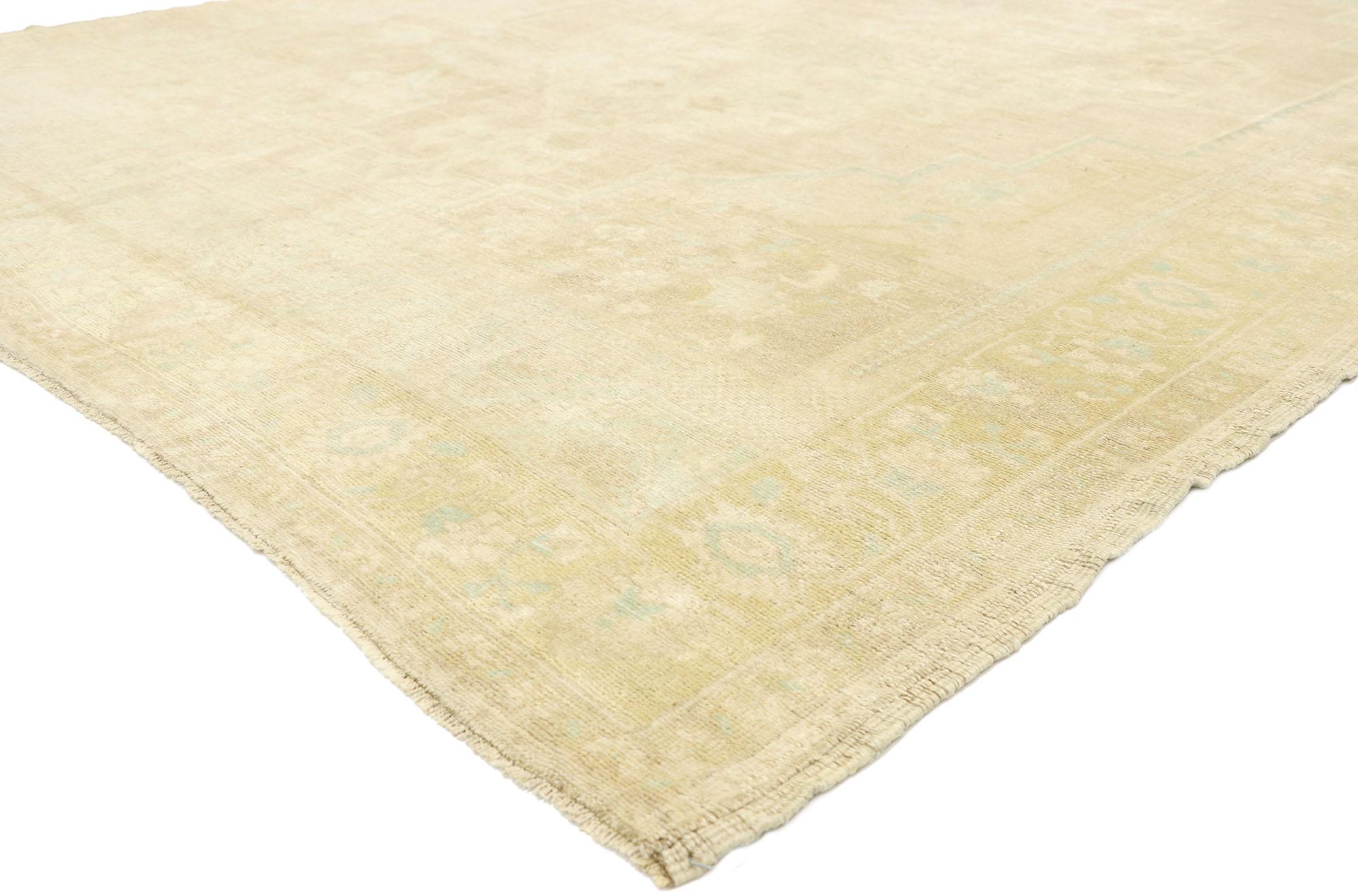 52987 vintage Turkish Oushak rug with Muted Hues and Monochromatic Mission style. Soft, bespoke vibes meet ancient traditions in this hand knotted wool vintage Turkish Oushak rug. The antique washed creamy-beige field features a large-scale