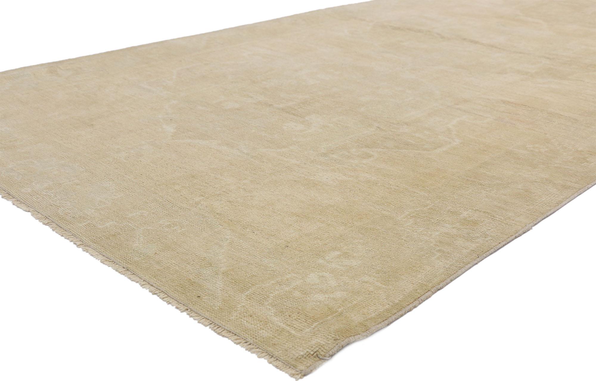 52503, vintage Turkish Oushak rug with Transitional style and neutral colors, wide hallway runner. This hand knotted wool vintage Turkish Oushak runner features three ethereal medallions in an open abrashed field. It is enclosed with a subtle