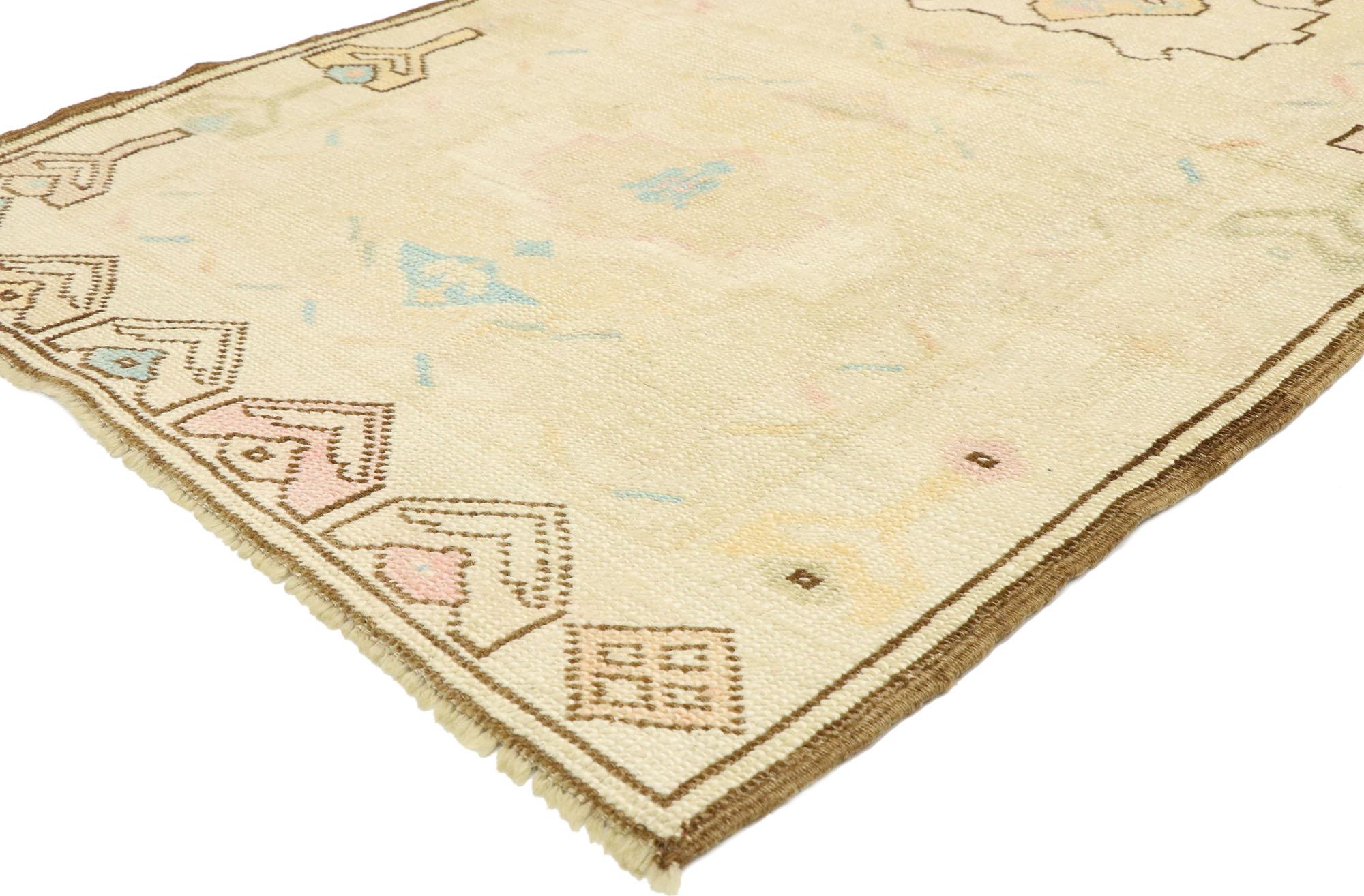 52938 vintage Turkish Oushak rug with Romantic Georgian Cottage French style. Soft, bespoke vibes meet English Country Cottage style in this hand knotted wool vintage Turkish Oushak rug. The champagne-beige antique washed field beautifully displays