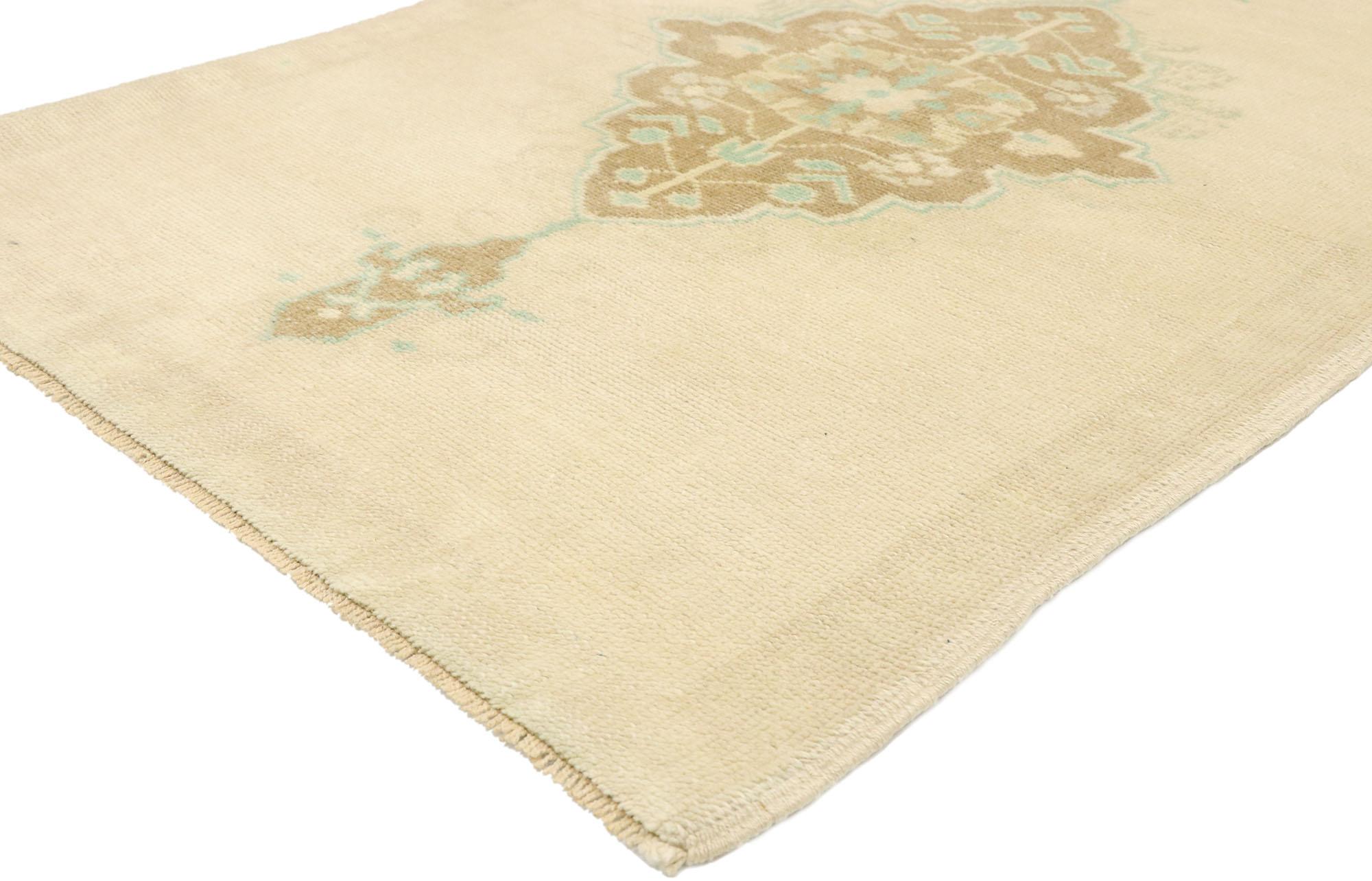 52982, vintage Turkish Oushak rug with Romantic Georgian cottage French style. Romantic Georgian French cottage style meets soft, bespoke vibes in this hand knotted wool vintage Turkish Oushak rug. The open sandy-beige antique washed field