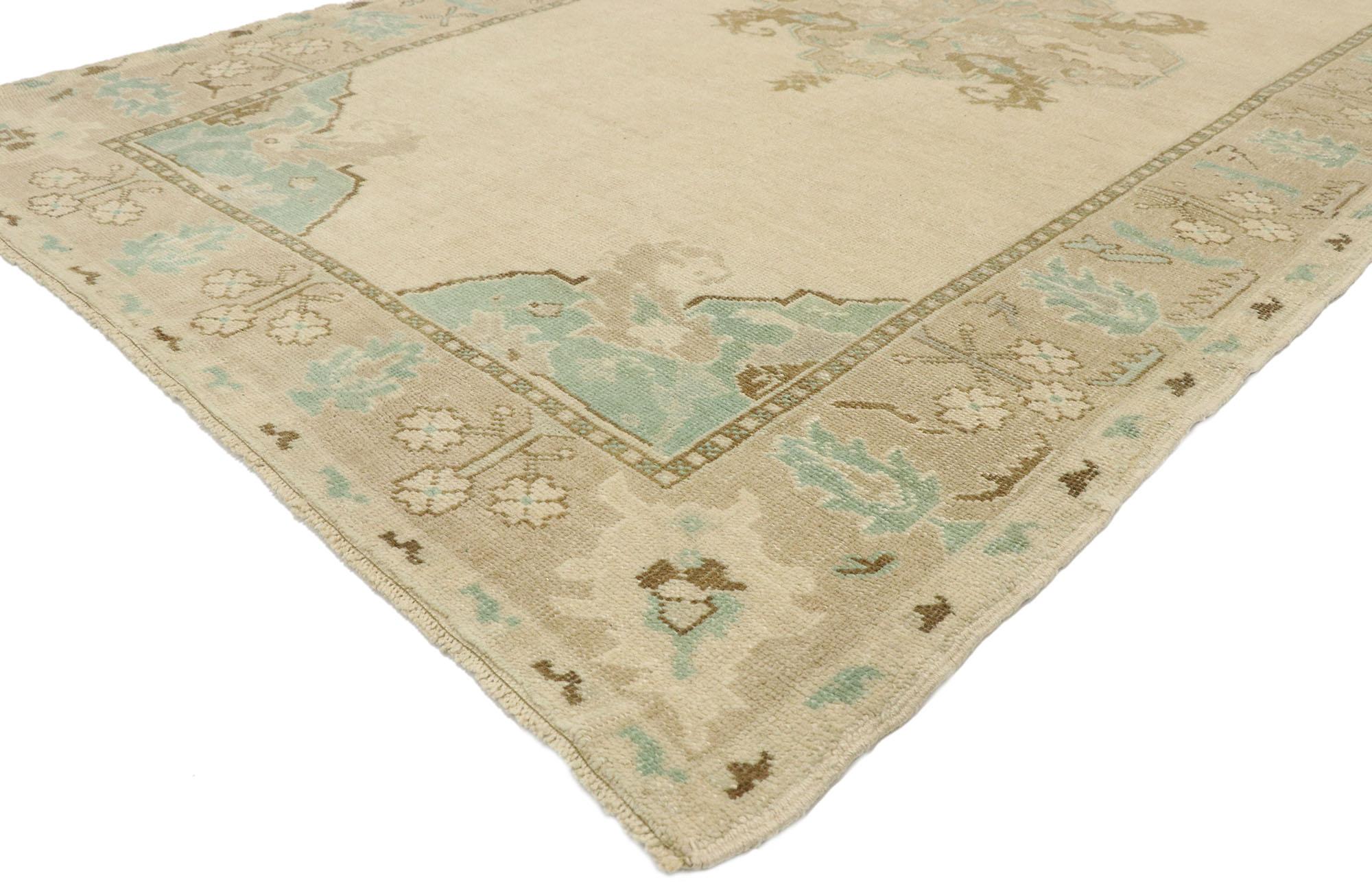 52972 vintage Turkish Oushak rug with Romantic Georgian French Cottage style. Showcasing effortless beauty and soft, bespoke vibes, this hand knotted wool vintage Turkish Oushak rug beautifully embodies Romantic Georgian French cottage style. The
