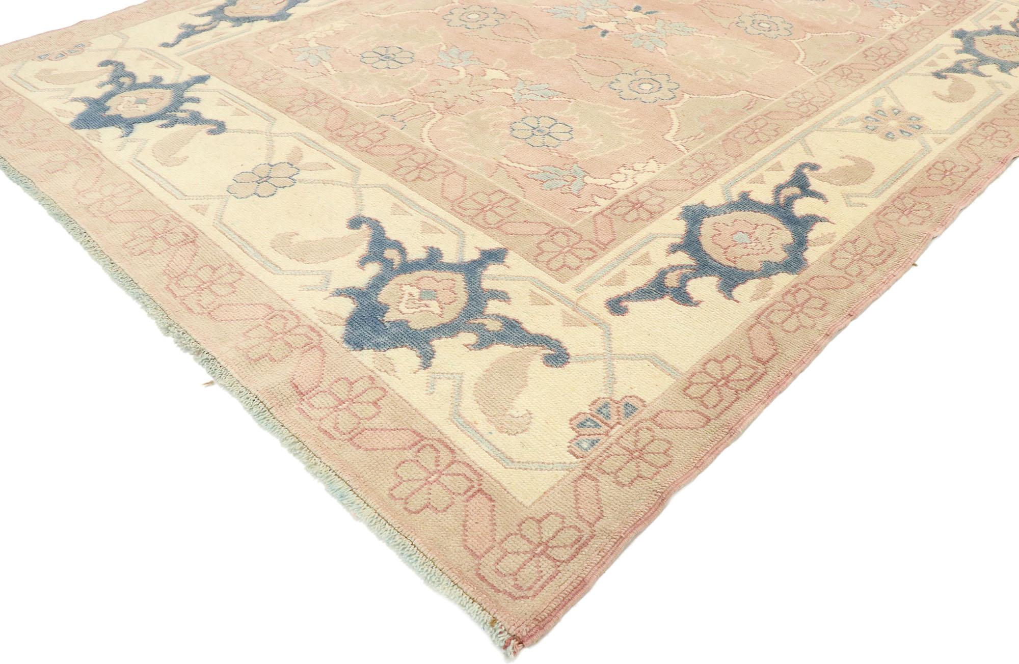 53055, vintage Turkish Oushak rug with Romantic Georgian style. With ornate details and well-balanced symmetry combined with a feminine color palette, this hand knotted wool vintage Turkish Oushak rug beautifully embodies Romantic Georgian style.