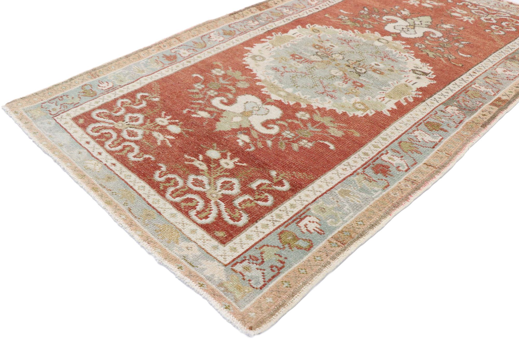 53523, vintage Turkish Oushak rug with rustic French Rococo style. French Rococo Romanticism meets timeless Anatolian tradition in this Classic style in this hand-knotted wool vintage Turkish Oushak rug. Set with an elaborate center round medallion