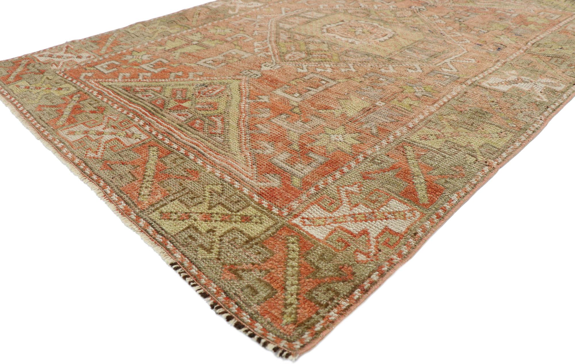 52762, vintage Turkish Oushak rug with rustic lodge and Tribal style 03'10 x 05'07. This hand knotted wool vintage Turkish Oushak rug features a central latch-hook medallion with ram's horn pendants at either end. Triangular ziggurat mounds along