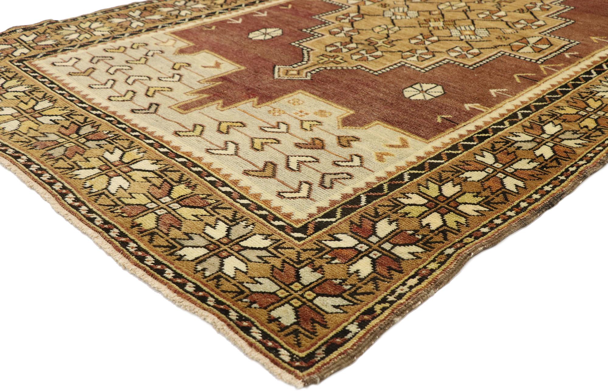 50176 vintage Turkish Oushak rug with Rustic Modern Artisan style. Warm and inviting, this hand knotted wool vintage Turkish Oushak rug features a stepped central medallion patterned inside with a roundel rosette pinwheel lattice floating in an