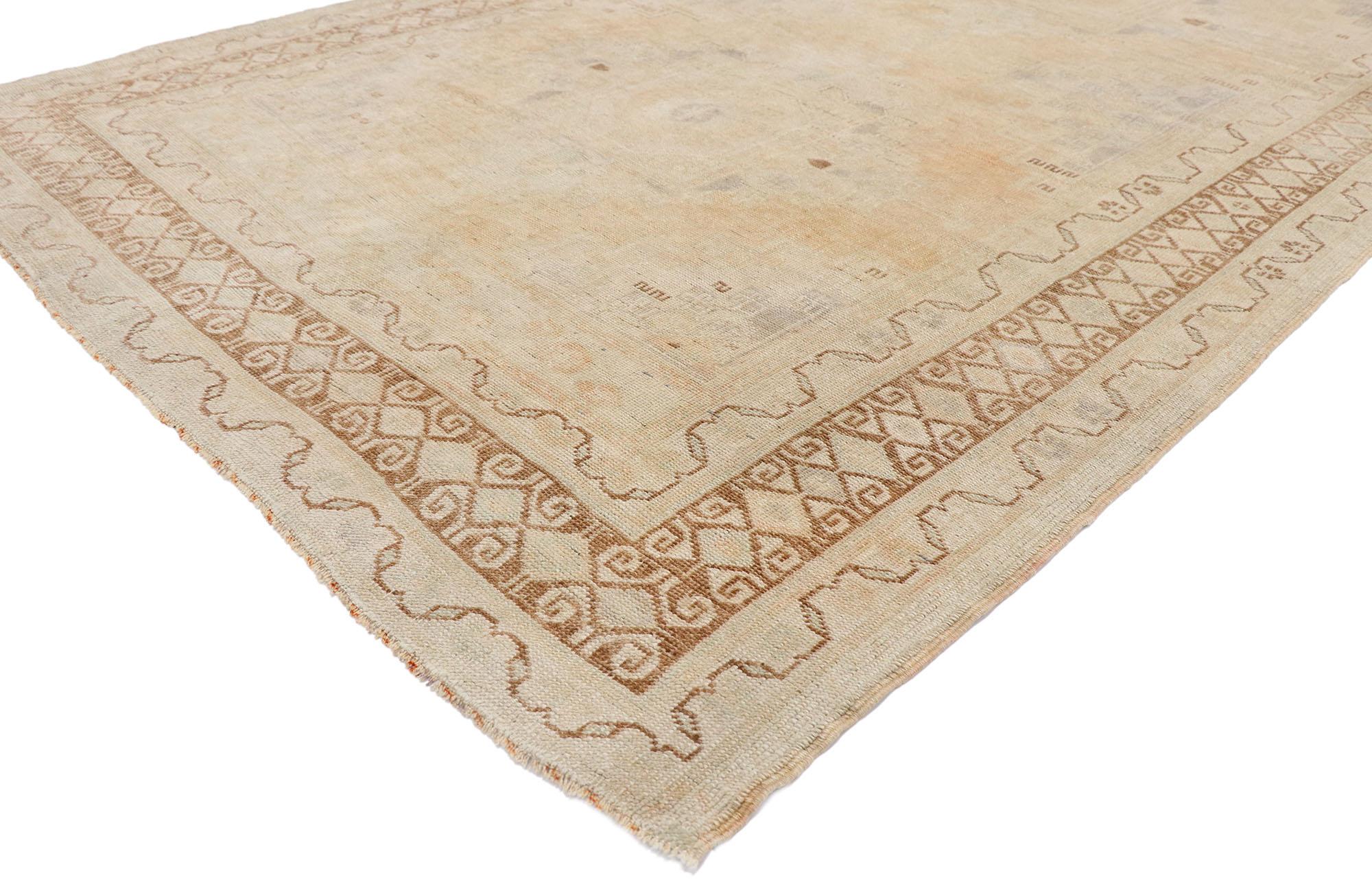 53560 Vintage Turkish Oushak rug with Rustic Shaker Style 05'03 x 09'04. Emanating grace and fine craftsmanship, this hand-knotted wool vintage Turkish Oushak rug charms with ease. The abrashed field features two botanical medallions decorated with