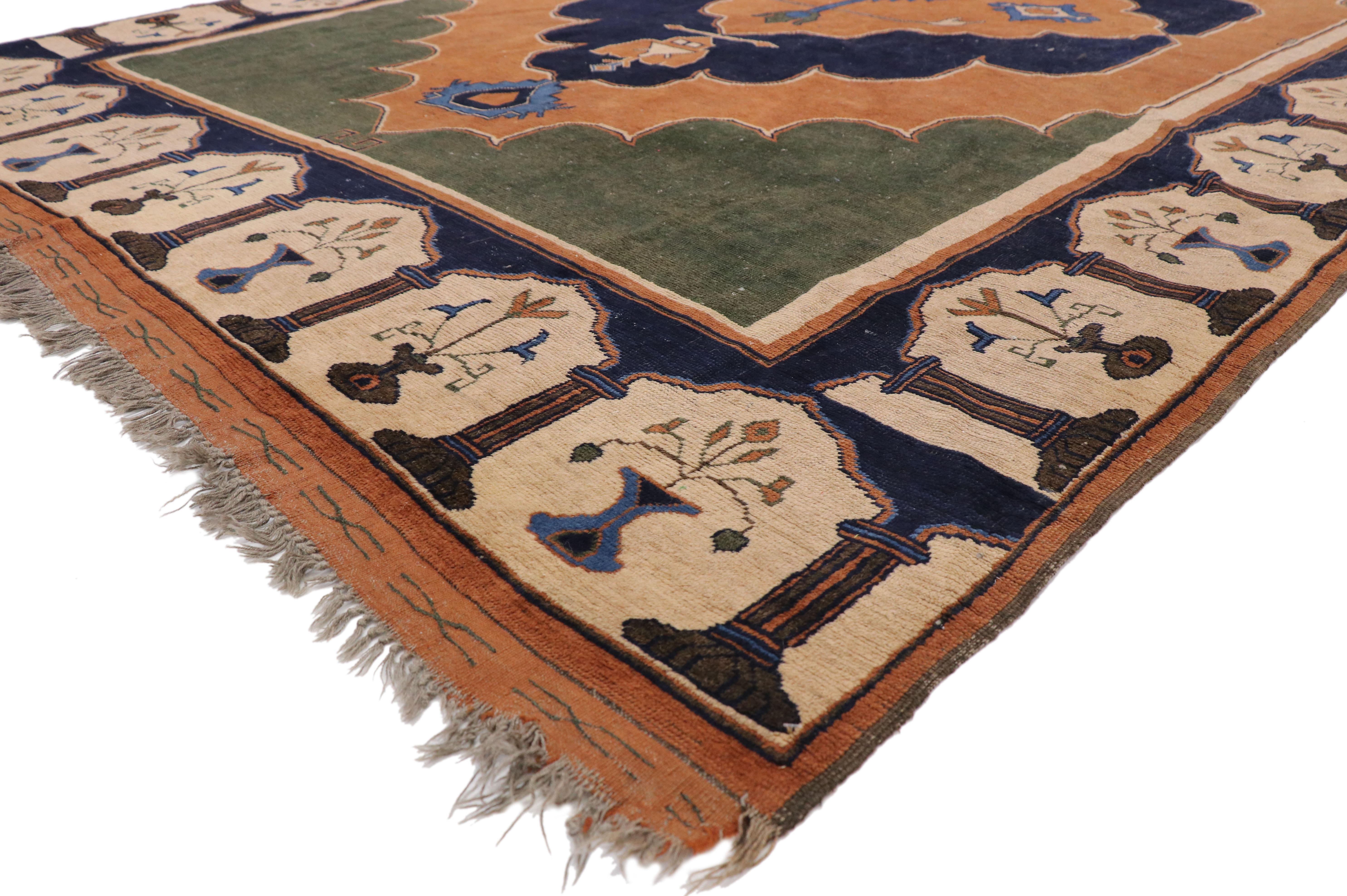 77342, vintage Turkish Oushak rug with Hypostyle mosque detailing and Spanish Revival style. This hand knotted wool vintage Turkish Oushak rug features a large scalloped floral medallion with palmette pendants floating on an abrashed terra cotta