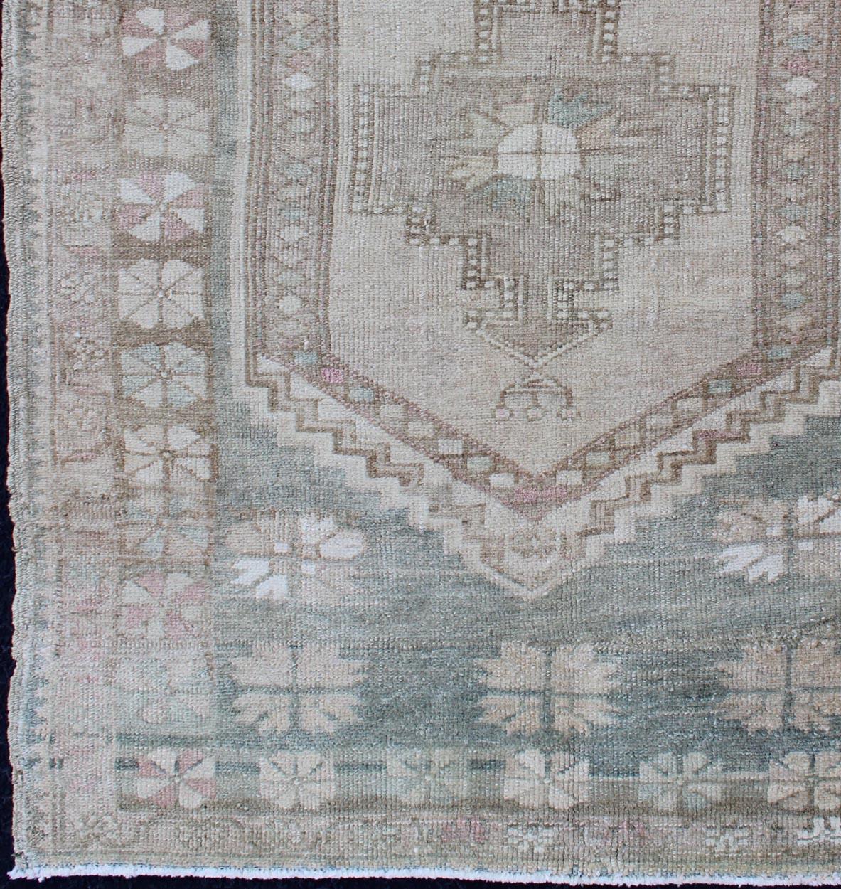 Hand-Knotted Vintage Turkish Oushak Rug with Stylized Medallion in Soft Green and Creams