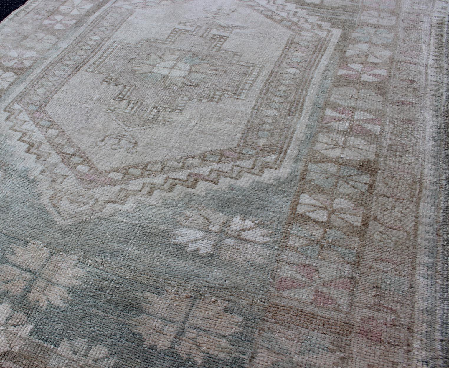 20th Century Vintage Turkish Oushak Rug with Stylized Medallion in Soft Green and Creams